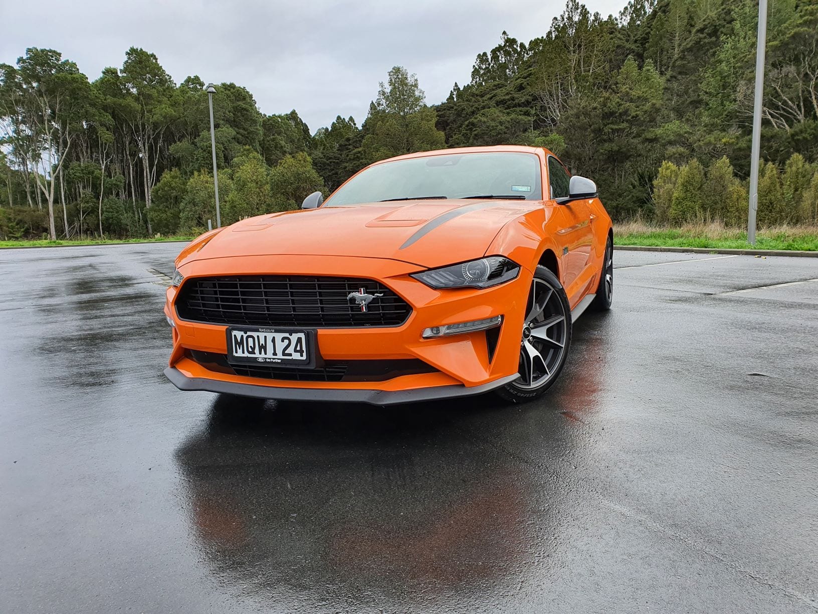 A frontal view of the Ford Mustang High Performance in orange