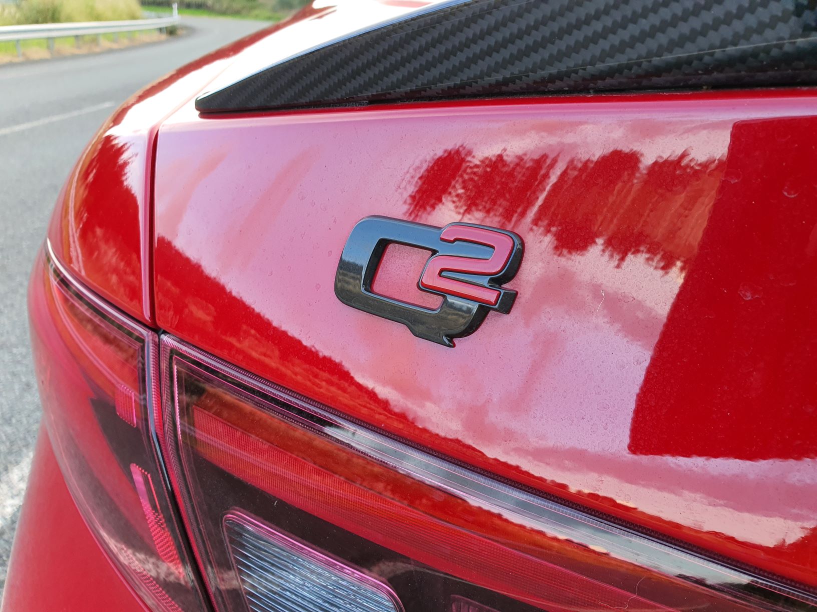 Close-up shot of the Q2 badge on the Alfa Romeo Giulia Veloce Carbon