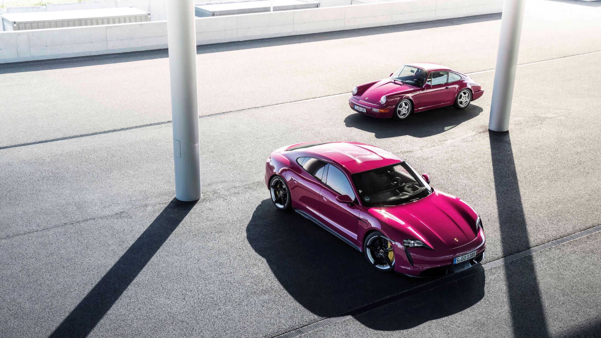 Porsche Taycan and 911 in Rubystone Red