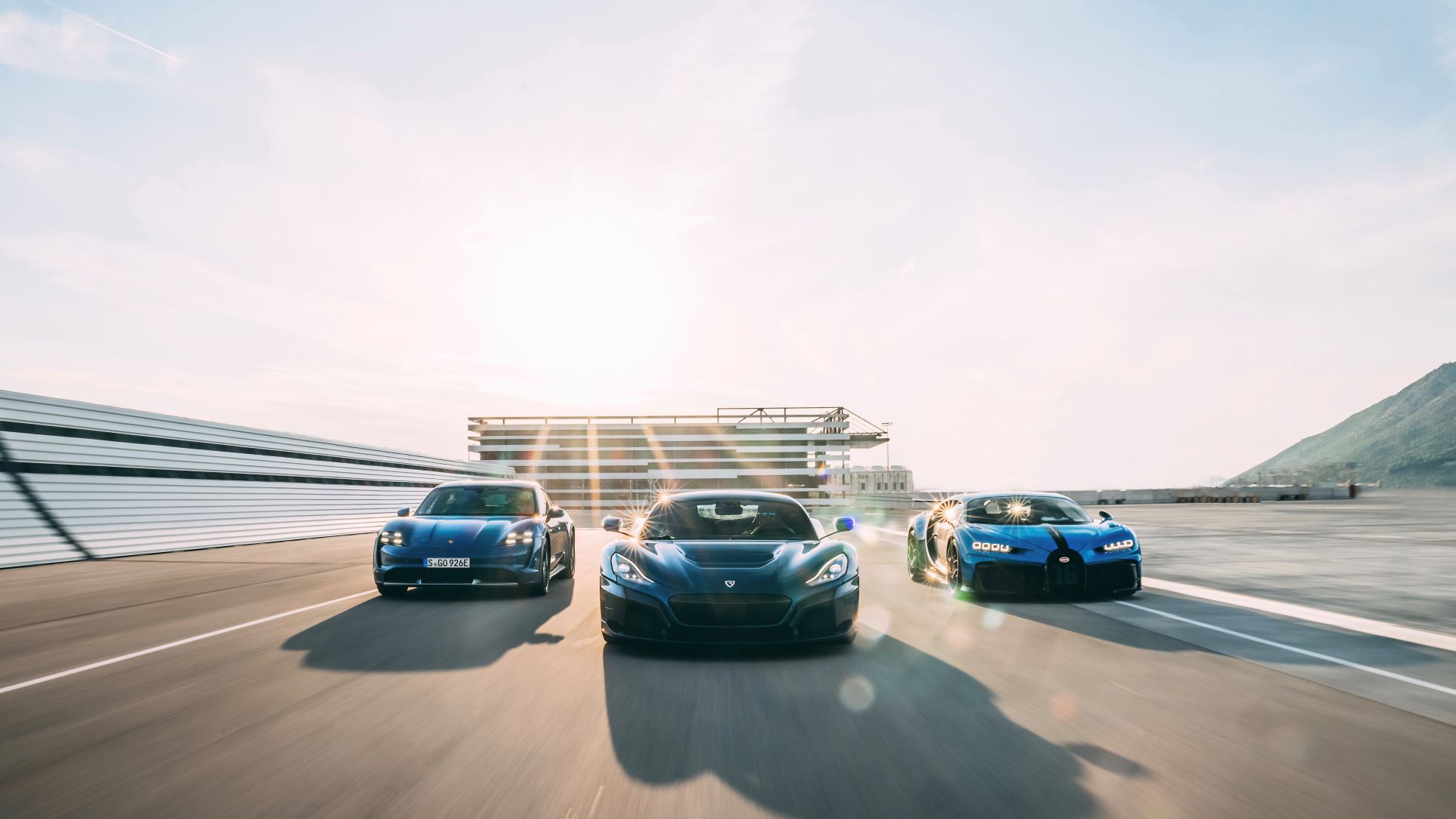 Rolling shot of cars by Porsche, Rimac and Bugatti