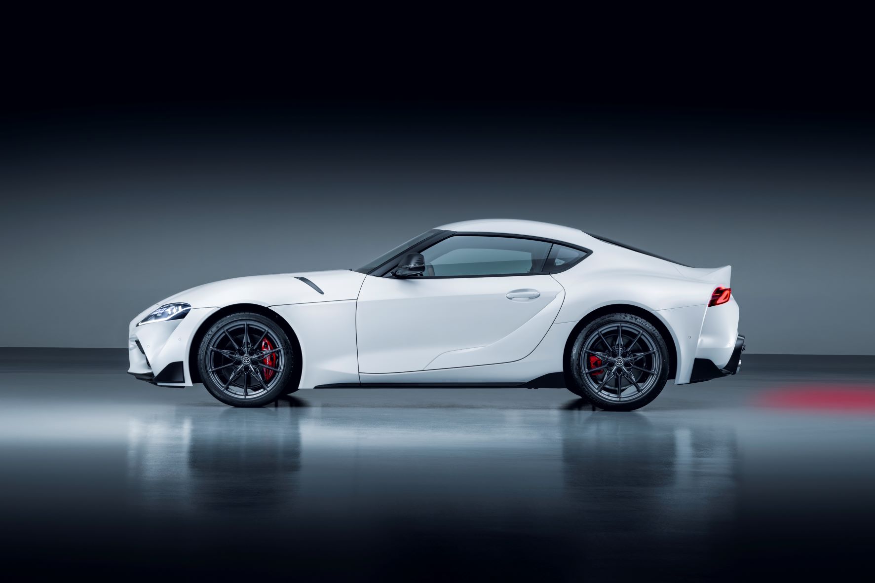 Side view of the updated Toyota GR Supra in matte Avalanche white metallic