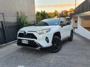 Front three quarters view of the new Toyota RAV4 XSE in white