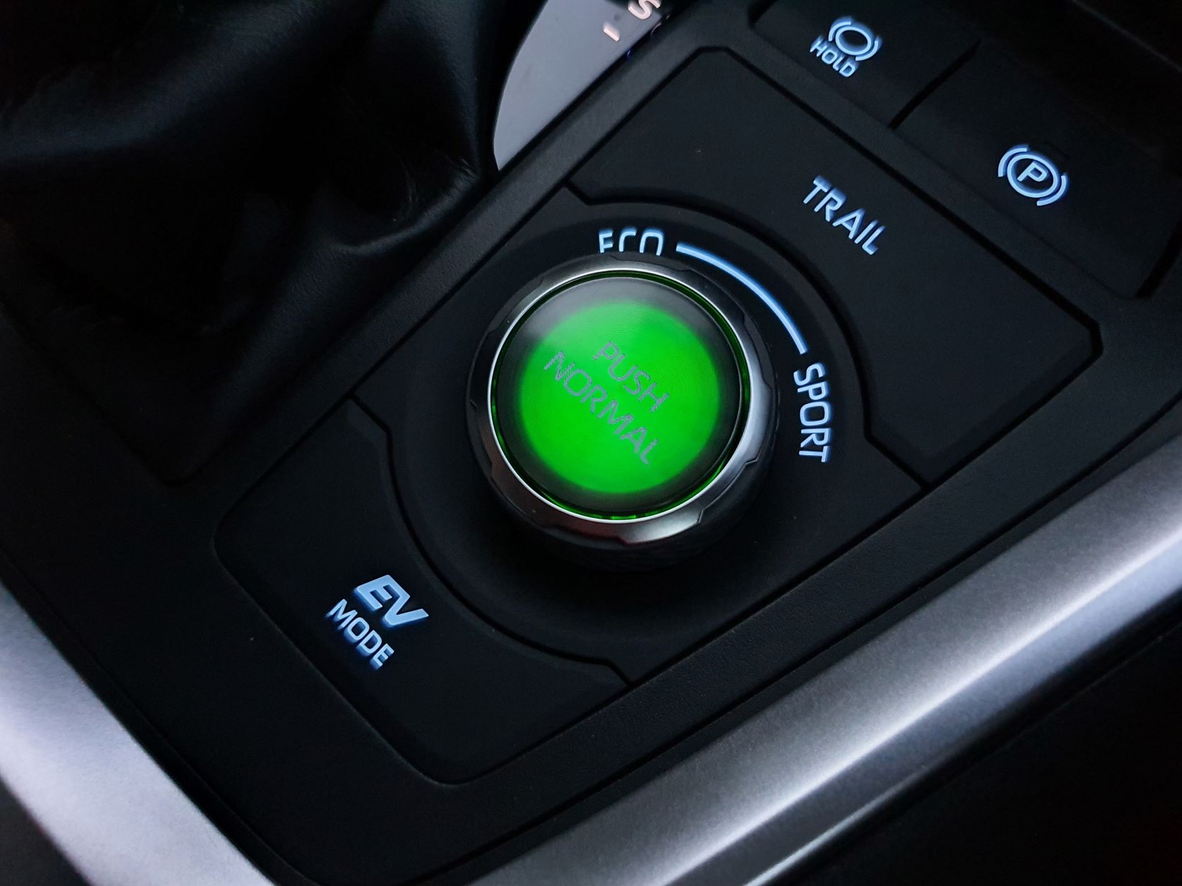 View of the eco mode button in the new Toyota RAV4 Hybrid XSE