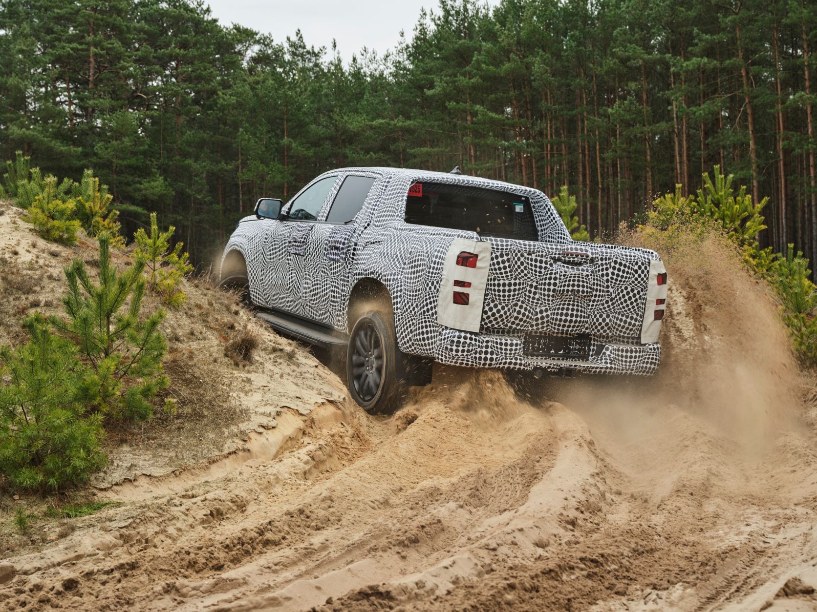 Rear three quarters view of the new Volkswagen Amarok off road testing