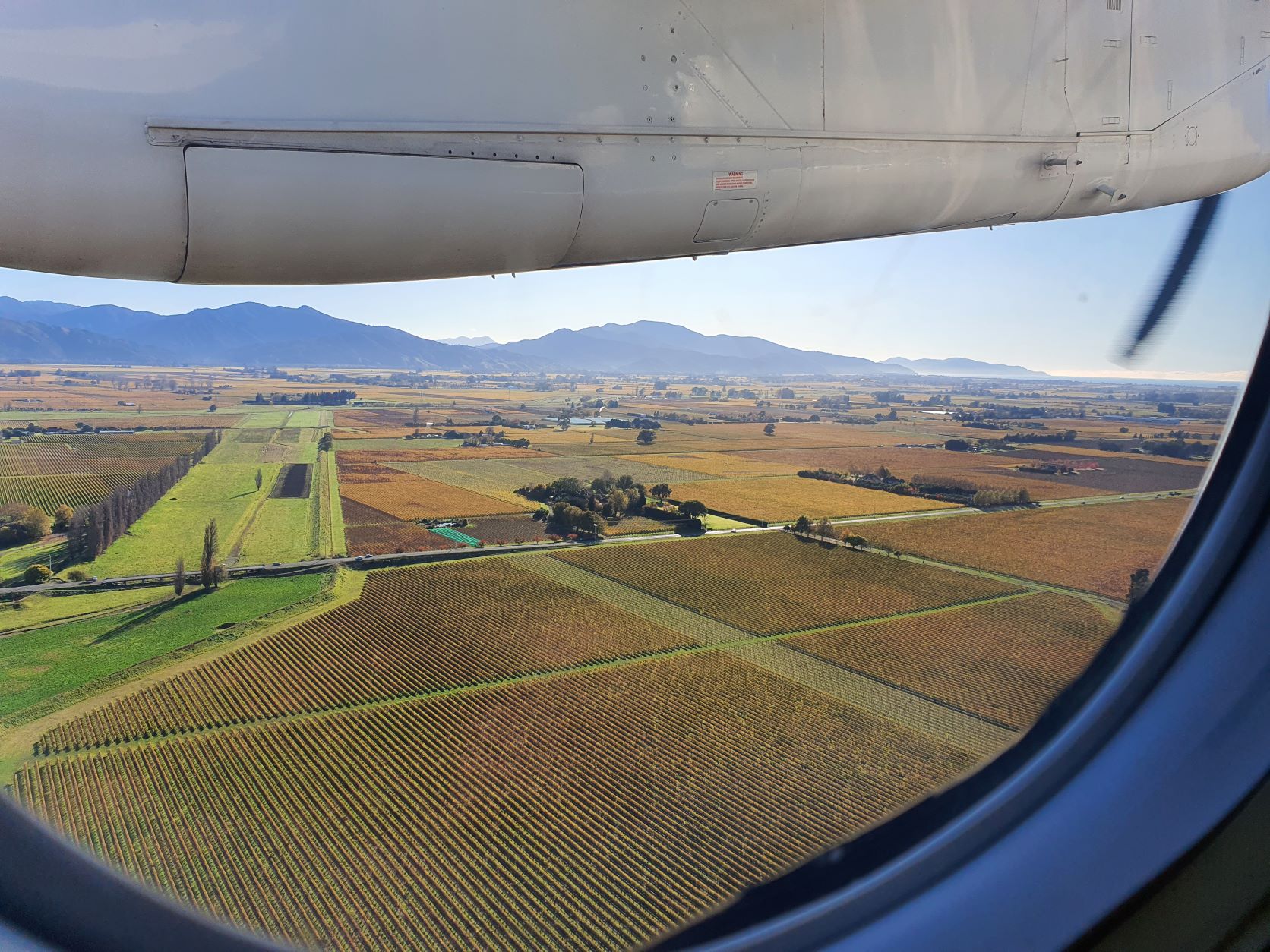 View of Marlborough and Blenheim, New Zealand from the window of a plane