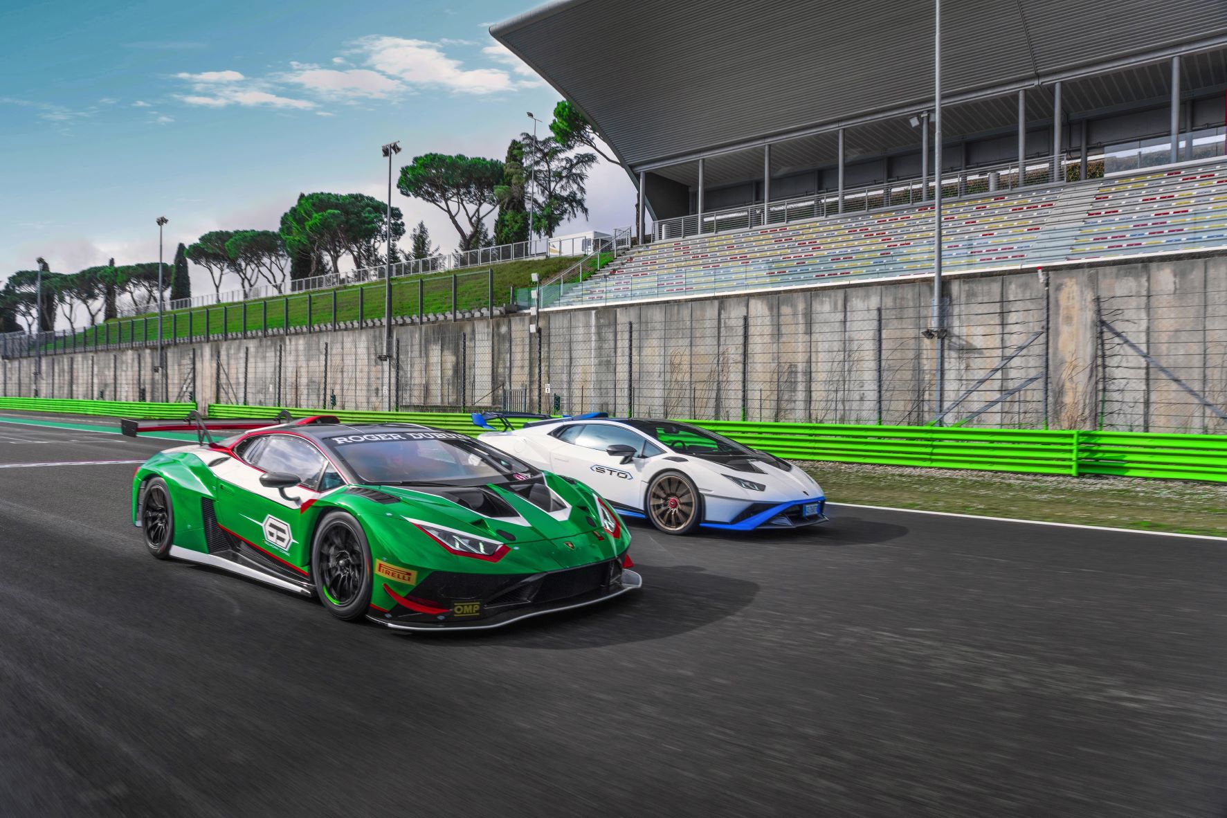 Two Lamborghini Huracans on a racetrack