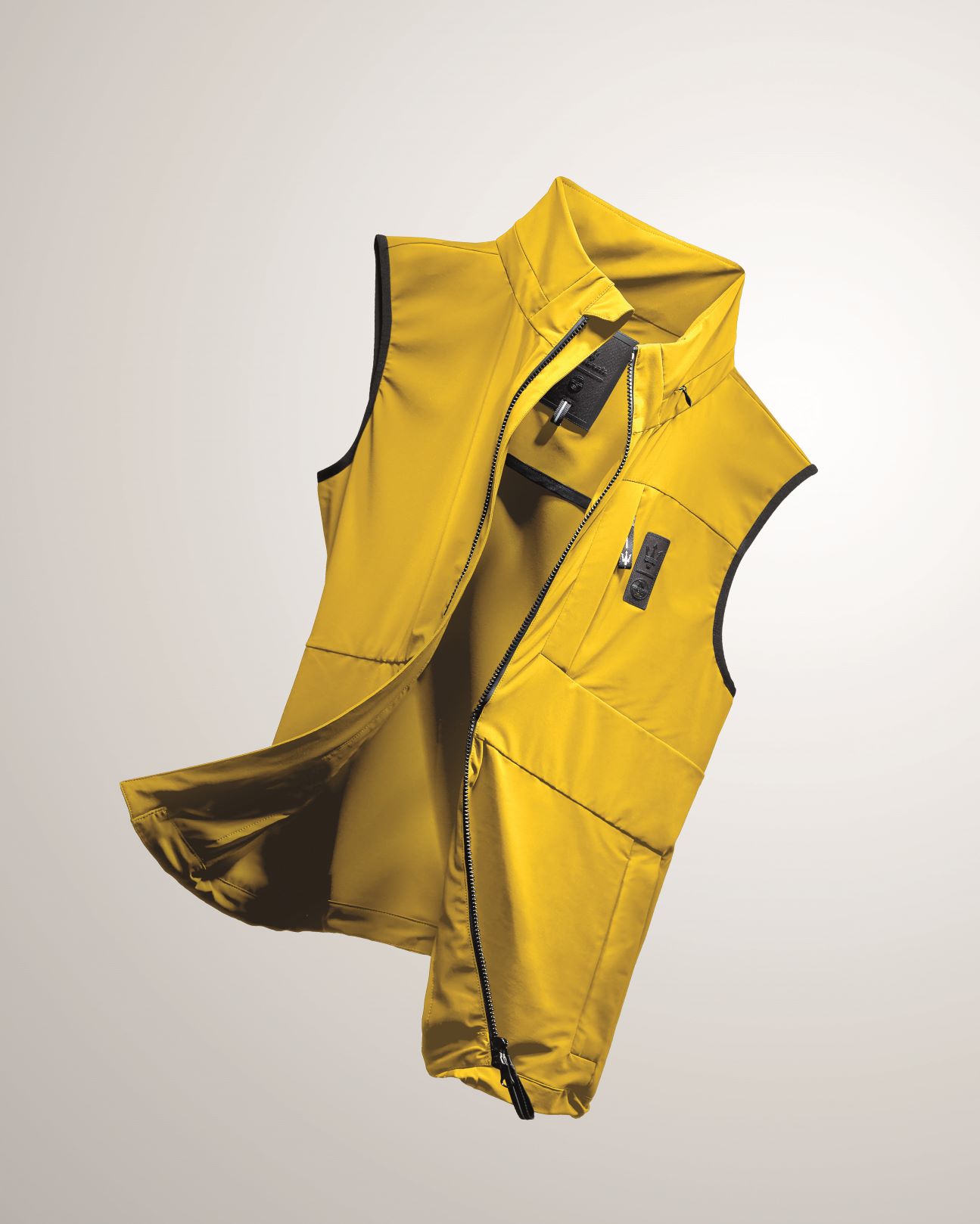 An insulated vest from the Maserati x North Sails collection. Colour is Maserati yellow