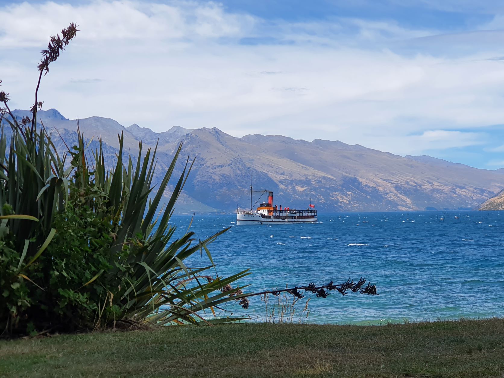TSS Earnslaw steamship as seen from the banks of Lake Queenstown