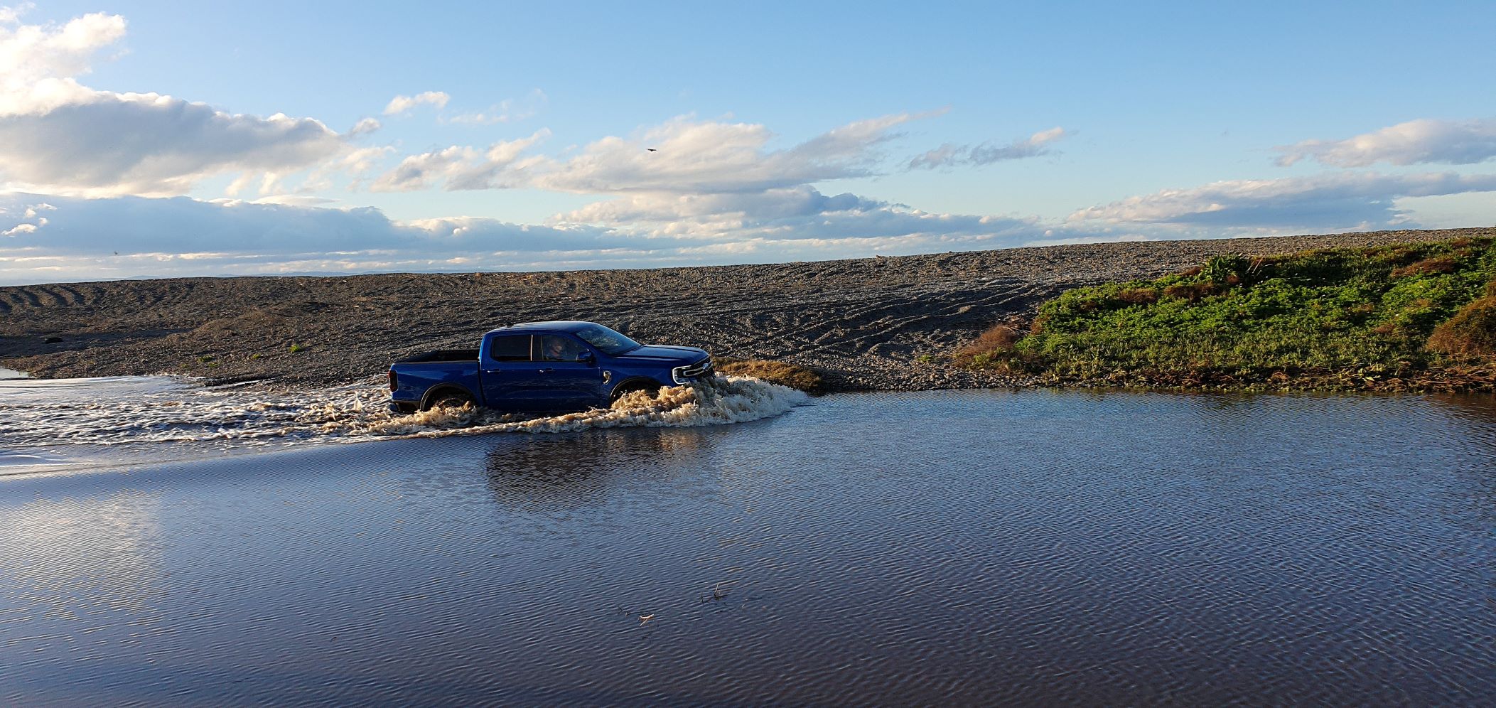 A 2022 Ford Ranger Bi-Turbo wading through a stream in Havelock North, New Zealand