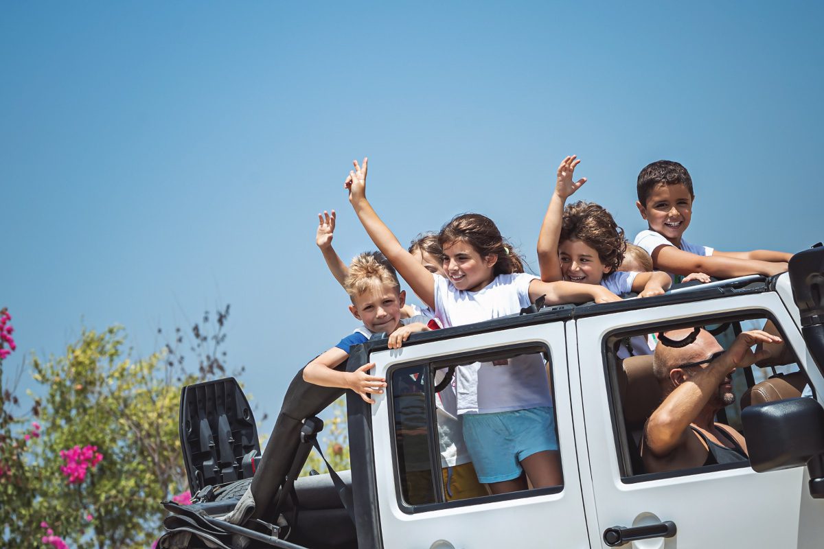 5 kids in a white Jeep