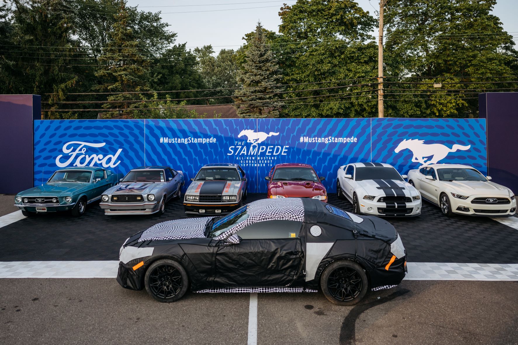 7 generations of Ford Mustangs lined up in Detroit