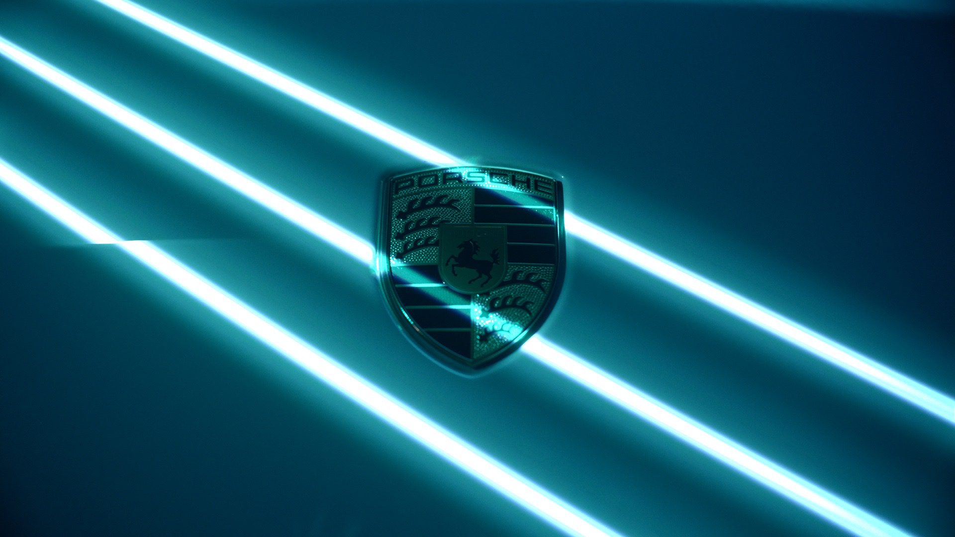 Porsche badge on the frozen blue colourway of the new Taycan