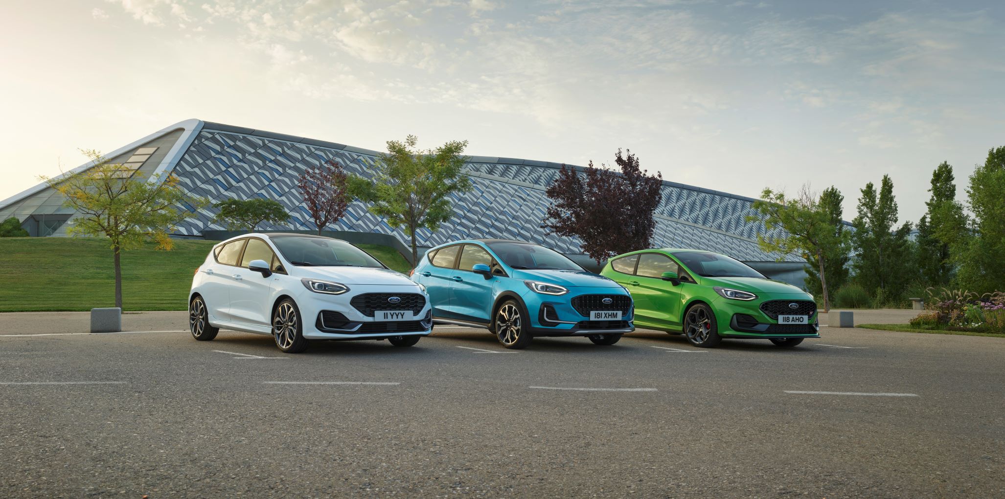 Three 2022 Ford Fiesta hatchbacks photographed in white, blue and green.