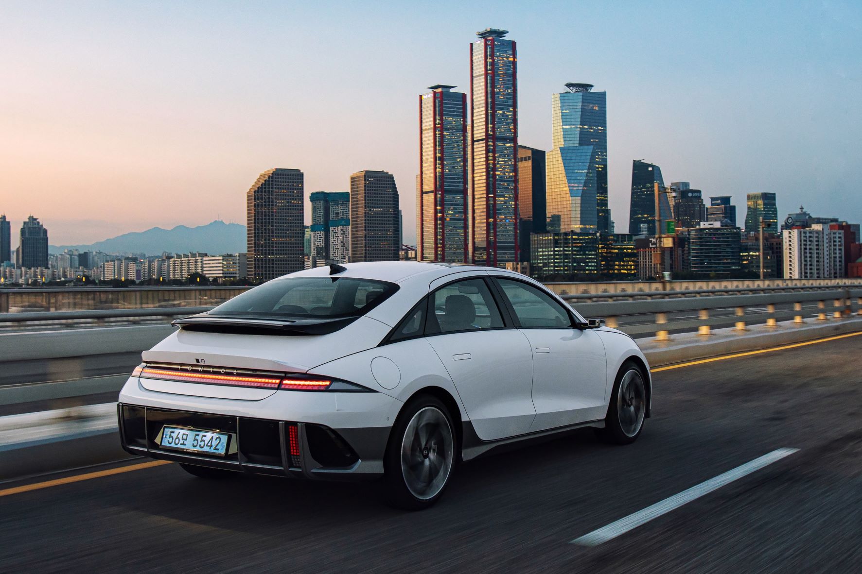 Rear three quarters view of the Hyundai IONIQ 6 on the road