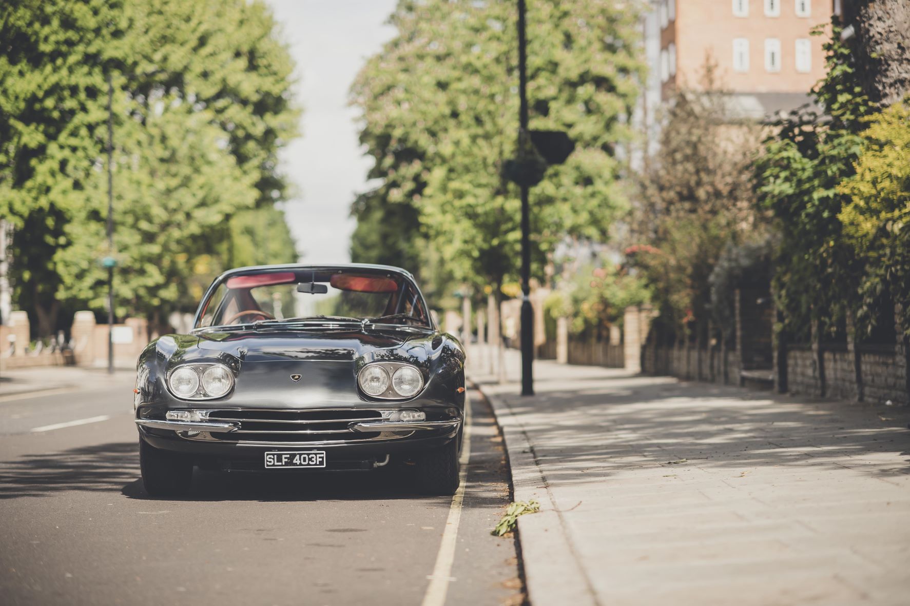 Front view of a Lamborghini 400GT 2+2 parked on Abbey Road