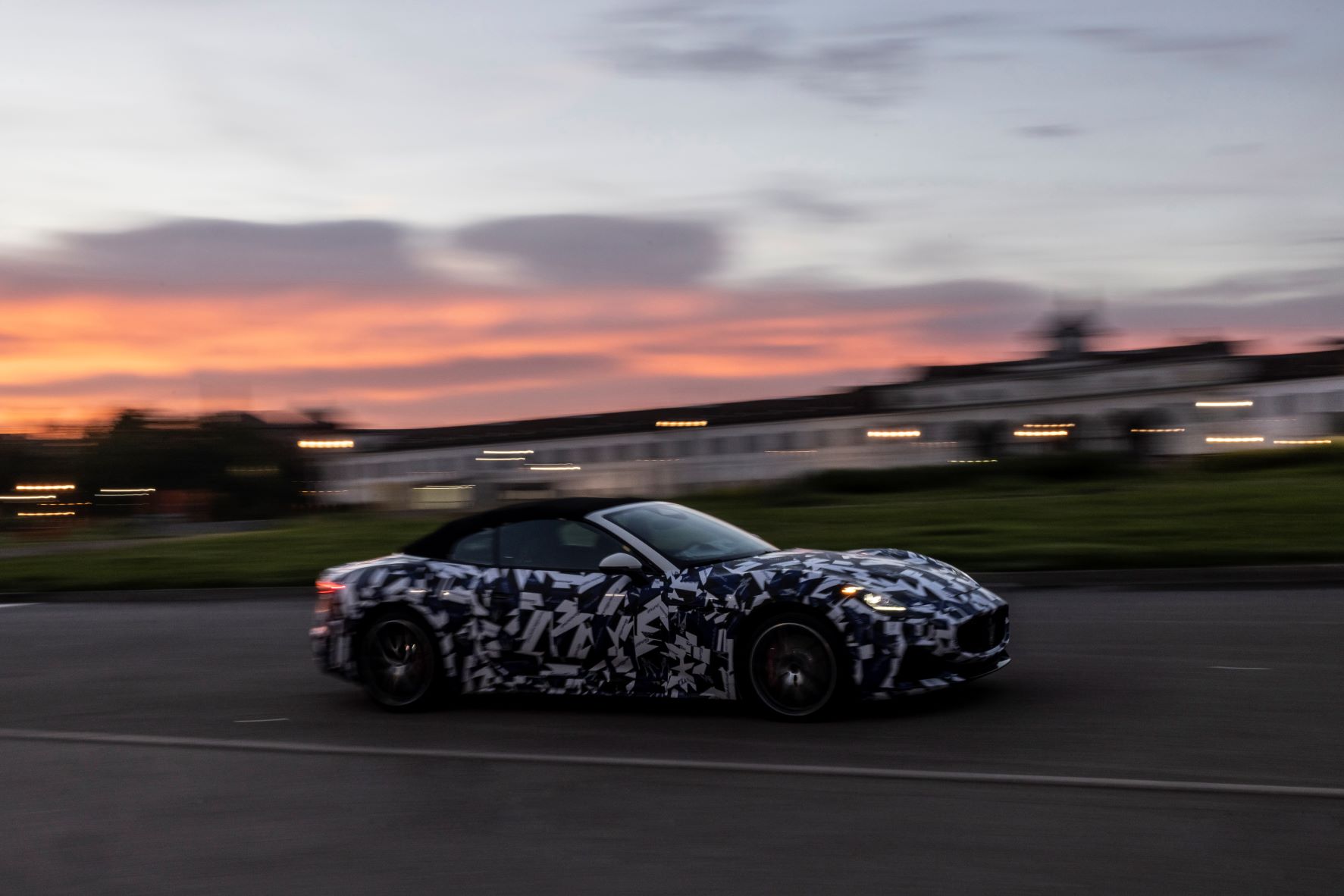 Side view of a Maserati GranCabrio prototype in motion