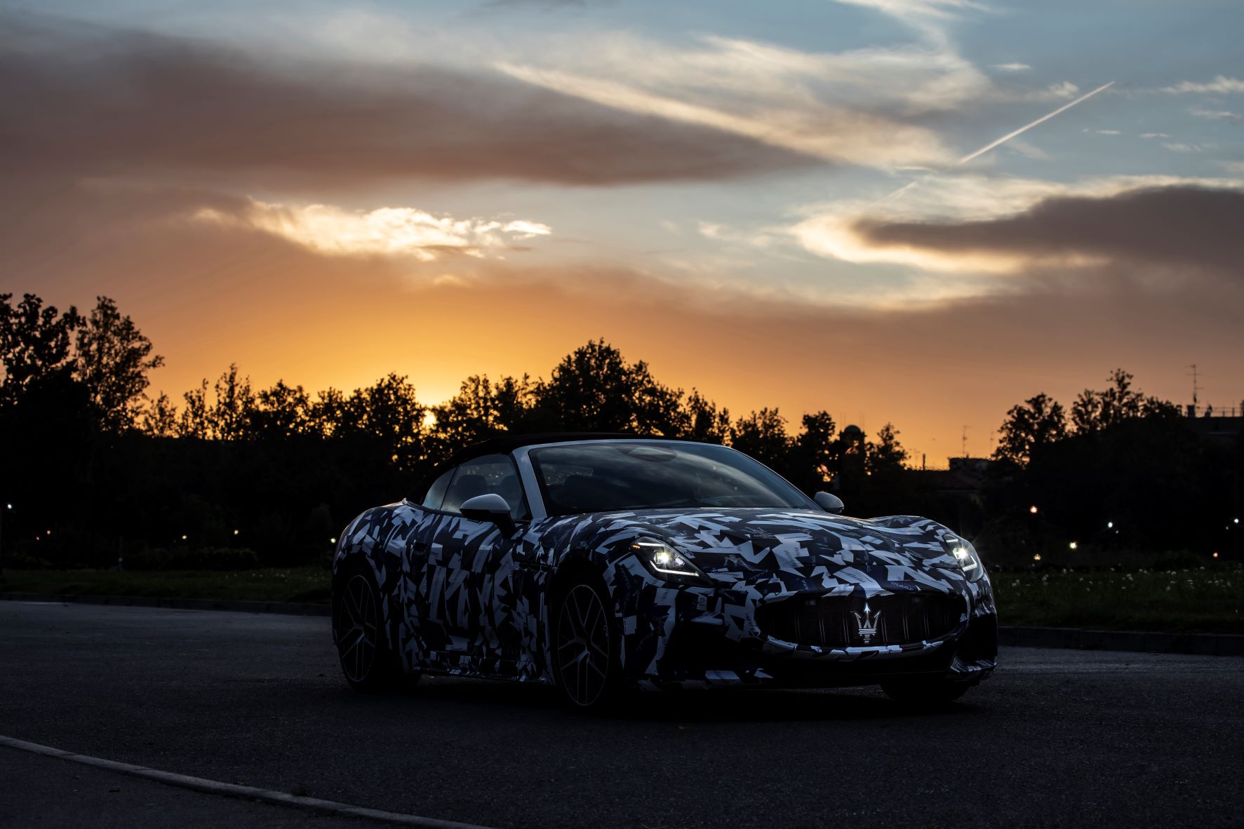 Front three quarters view of the new Maserati GranCabrio prototype at sunset