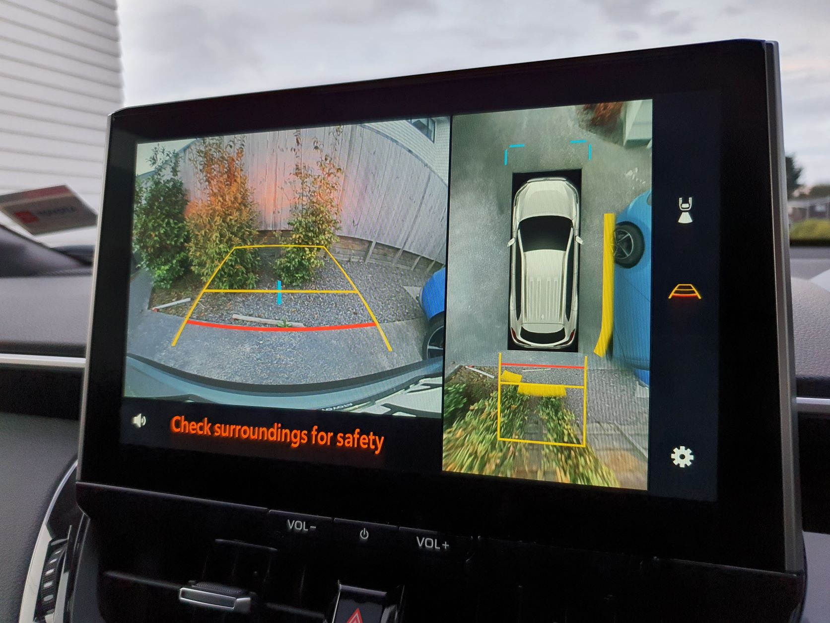 Reversing camera and 360 degree camera views on the infotainment screen of a 2022 Toyota Corolla Cross Limited Hybrid E-Four AWD in Safari Green
