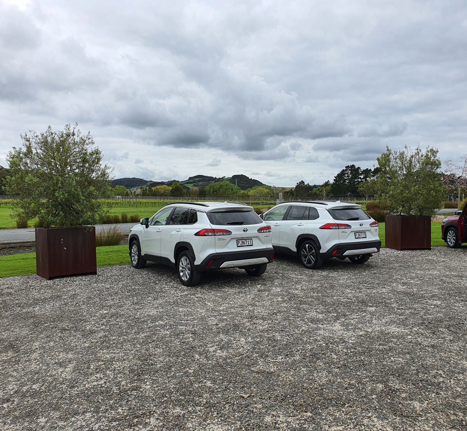 Two white Toyota Corolla Crosses at the Hunting Lodge, Auckland