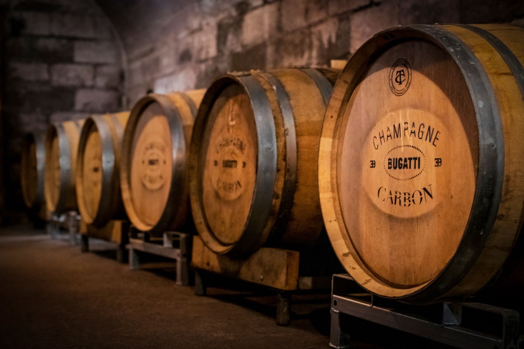 Oak barrel cases of Champagne Carbon vintage champagnes created for Bugatti.