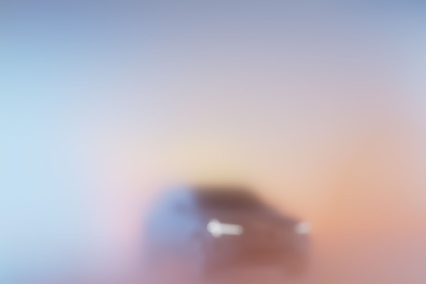 Blurred front view of the upcoming Volvo EX90 fully electric SUV