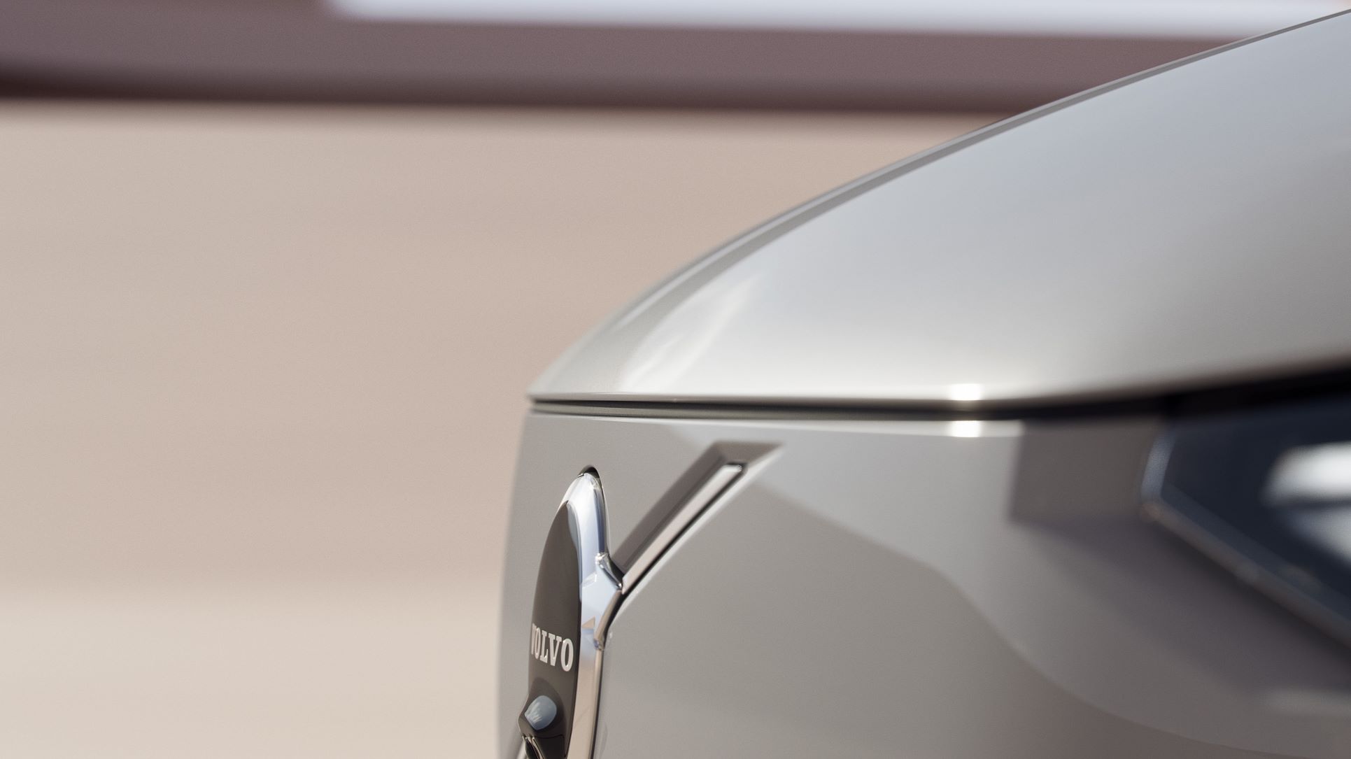 Teaser image of the Volvo badge on the nose of the new Volvo EX90 EV