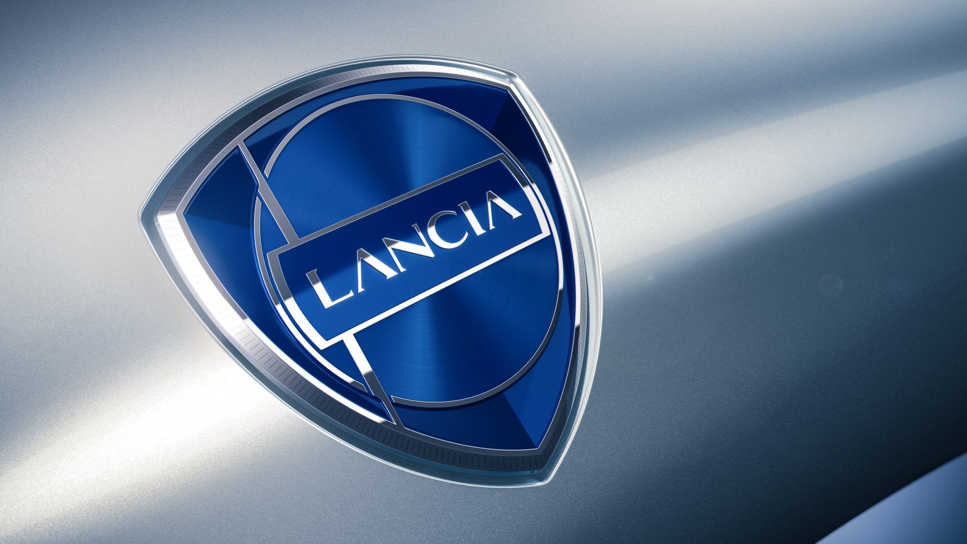 A side angle view of the new Lancia logo in blue.
