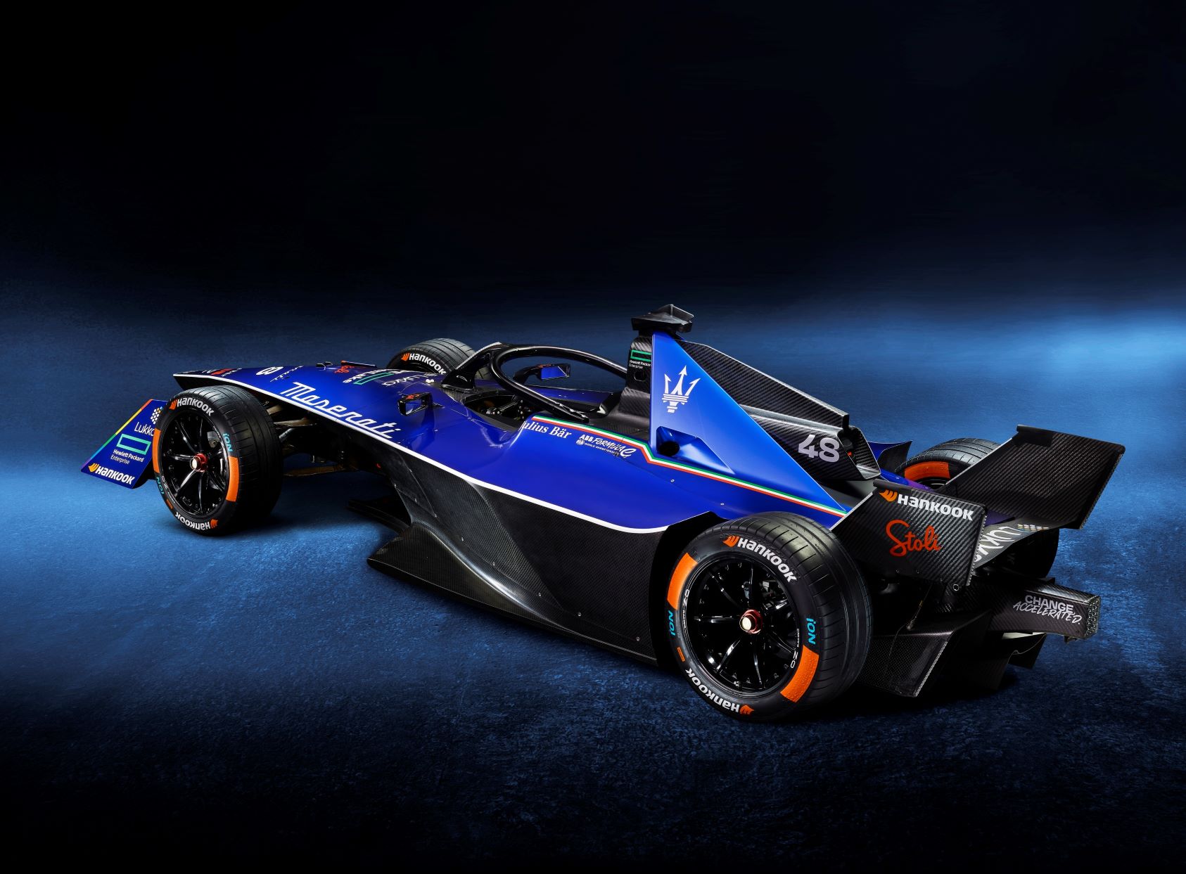 Rear three quarters view of the MSG Maserati Racing Gen 3 Formula E racecar in blue.