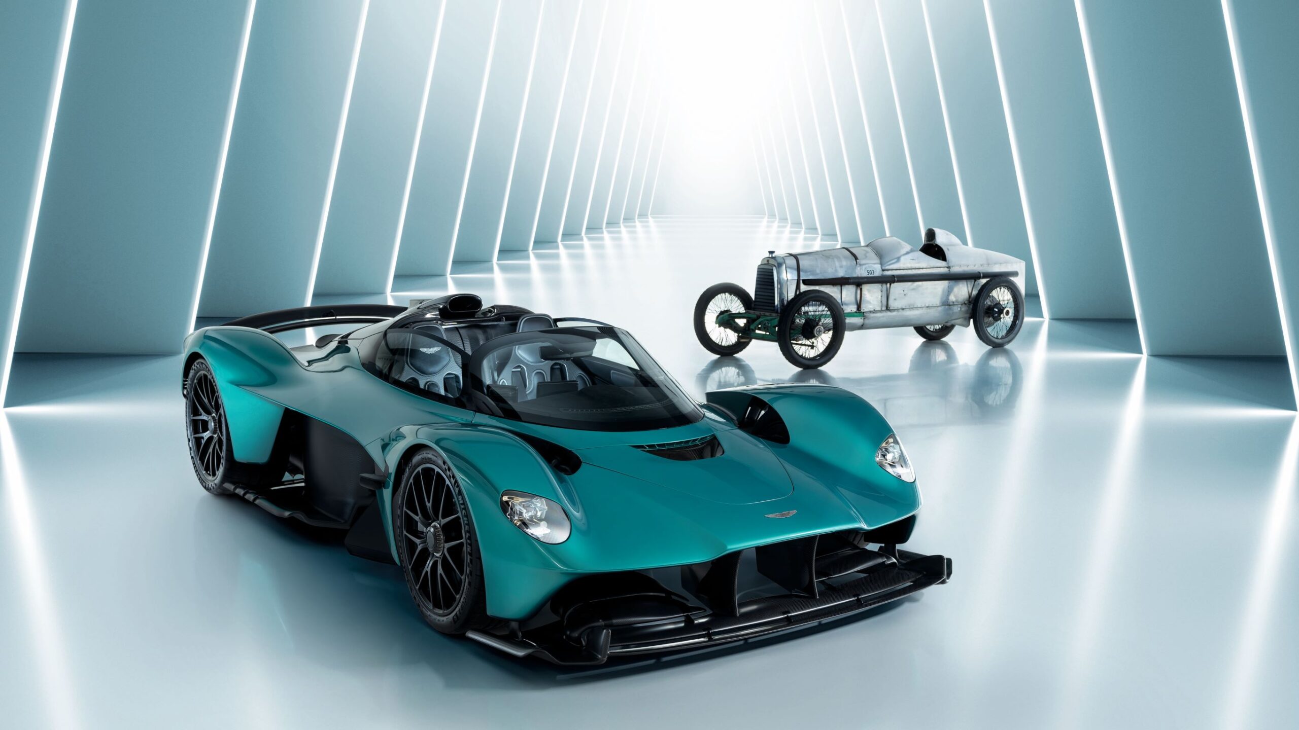 Zoomed out view of an Aston Martin Valkyrie and an Aston Martin Razor Blade racecar.