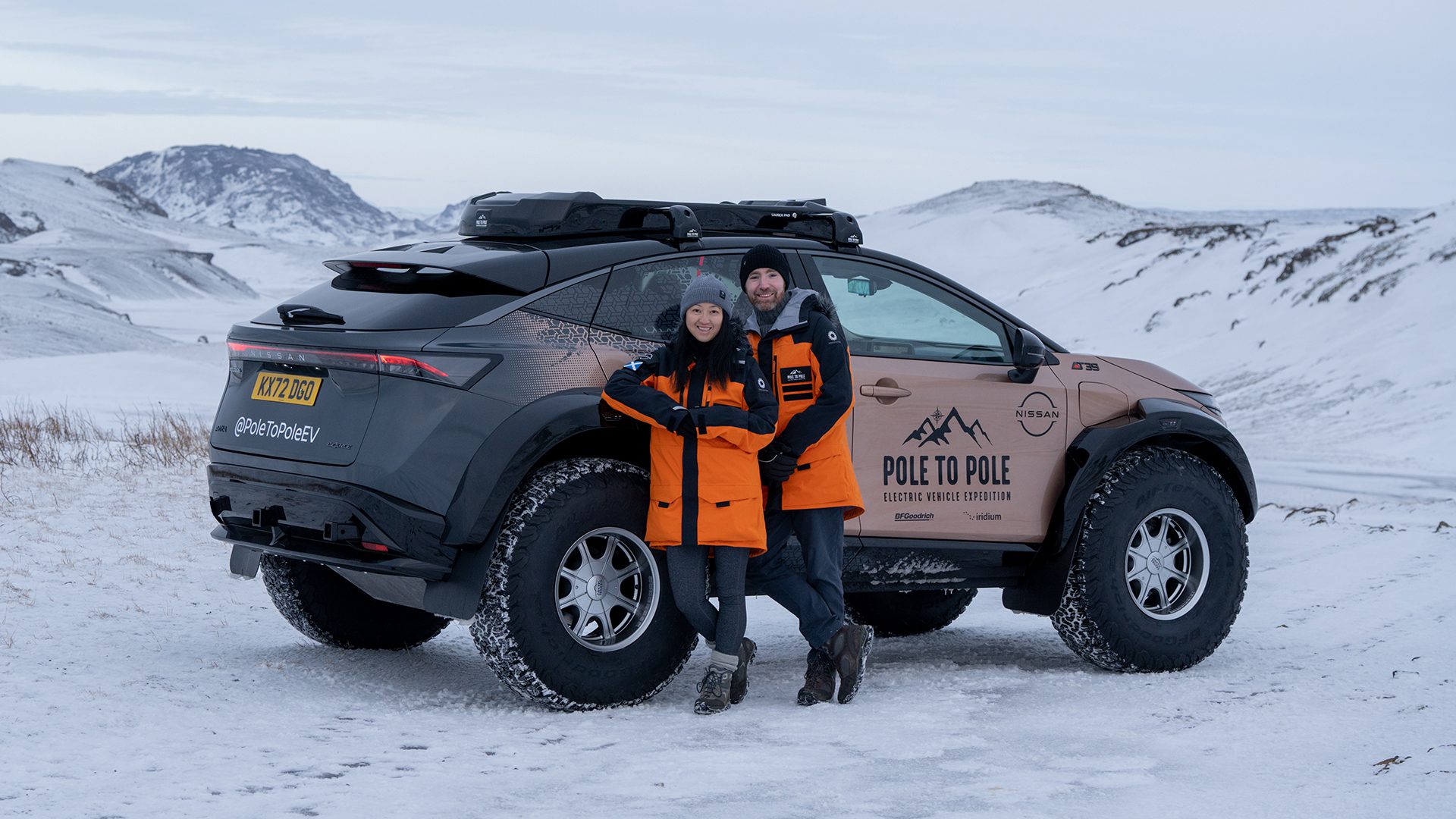 Chris and Julie Ramsey in front of the Pole to Pole Nissan Ariya EV