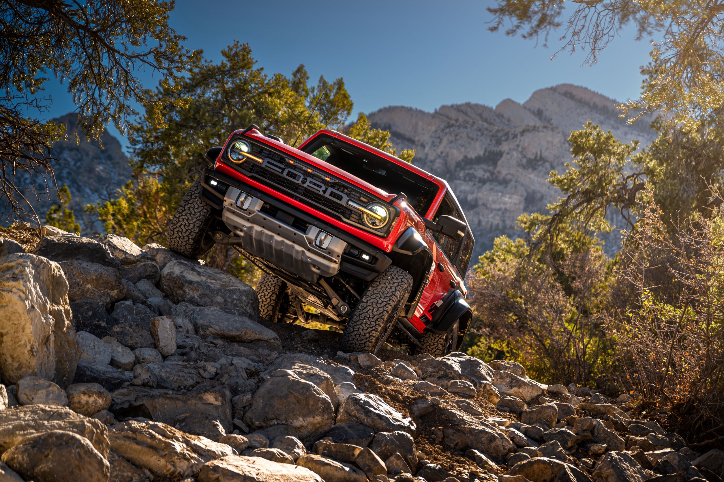 A red Ford Bronco Raptor off-roading on the course in Las Vegas.
