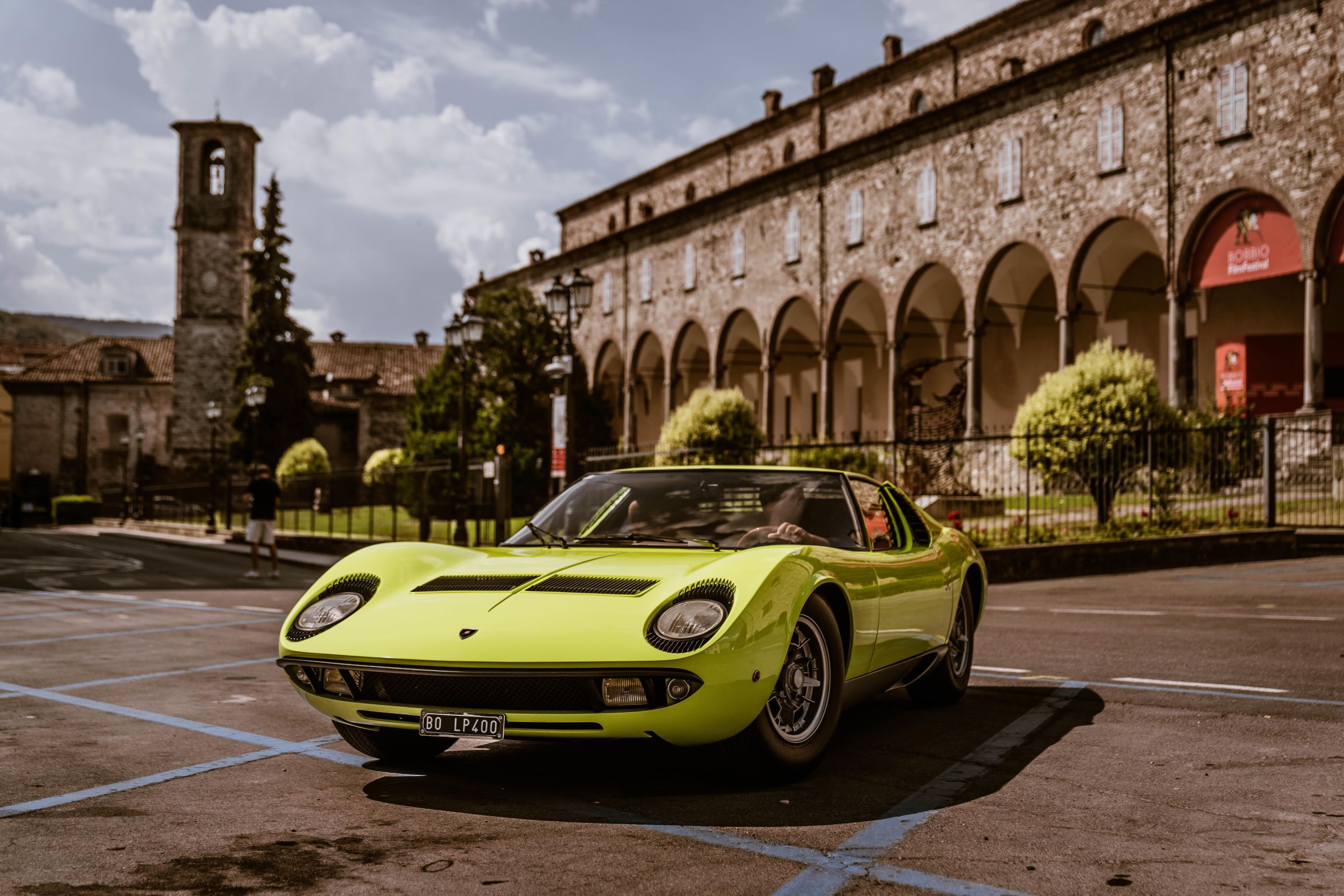 A green Lamborghini Miura P400 posing in Italy.