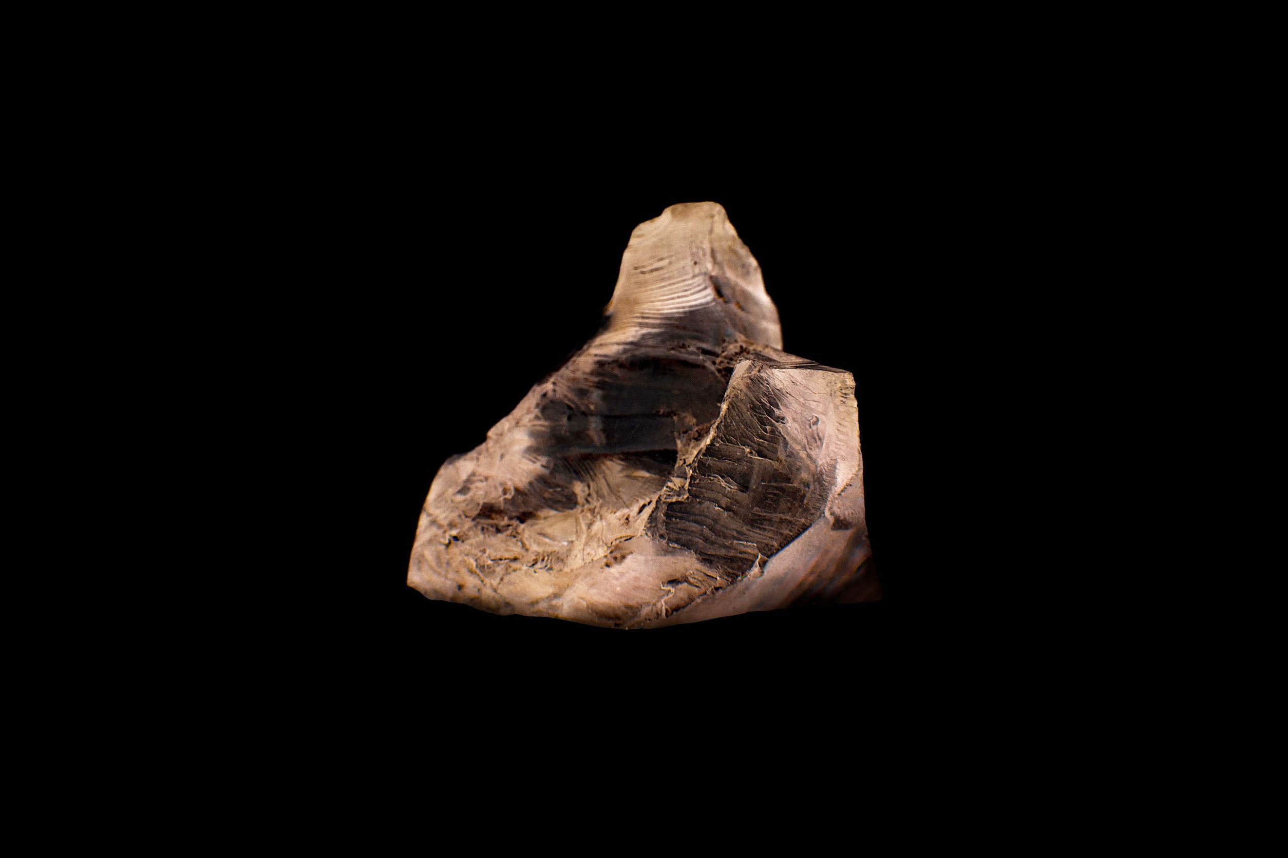 A block of Lithium pictured on a black background.