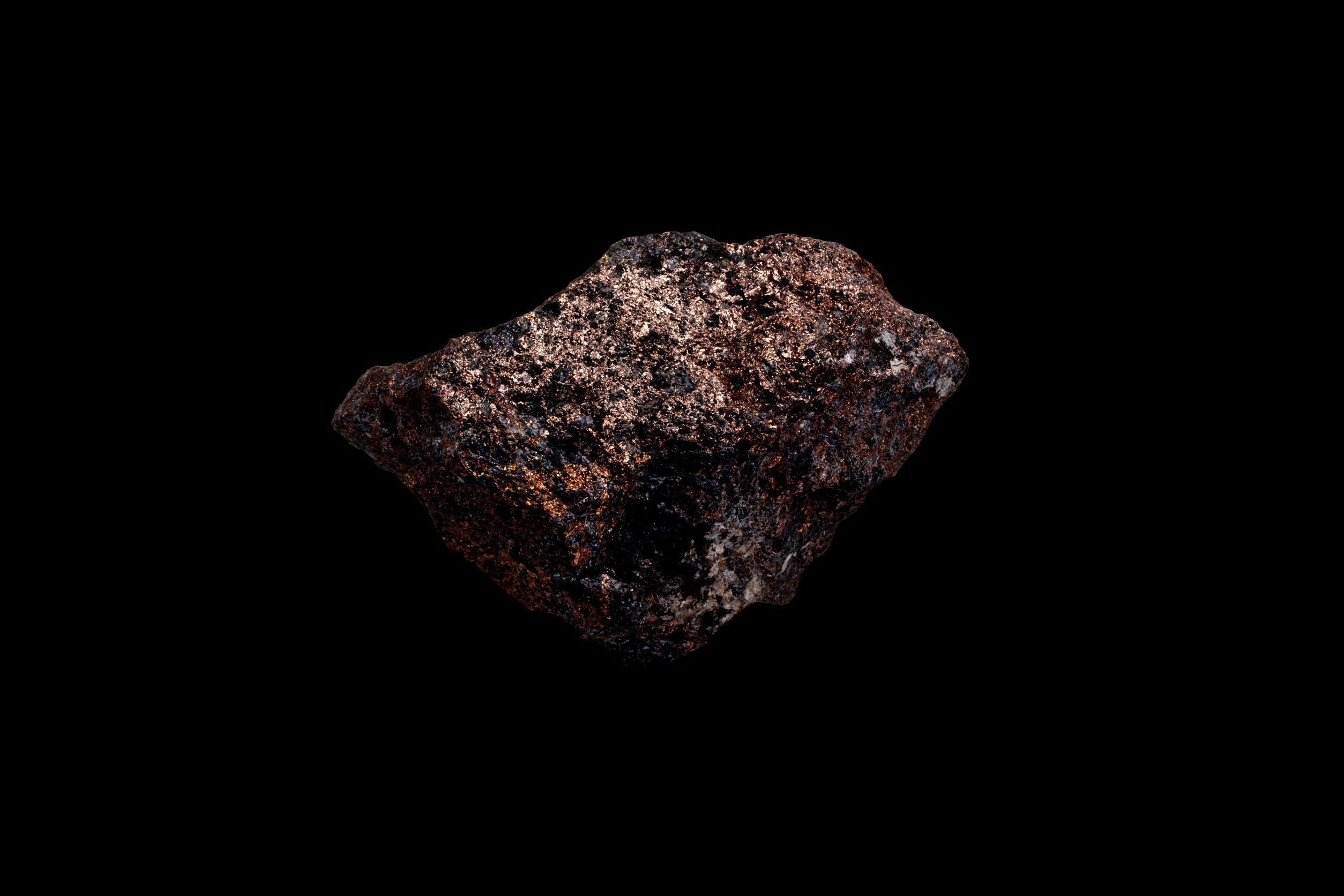 A block of Nickel with a black background.