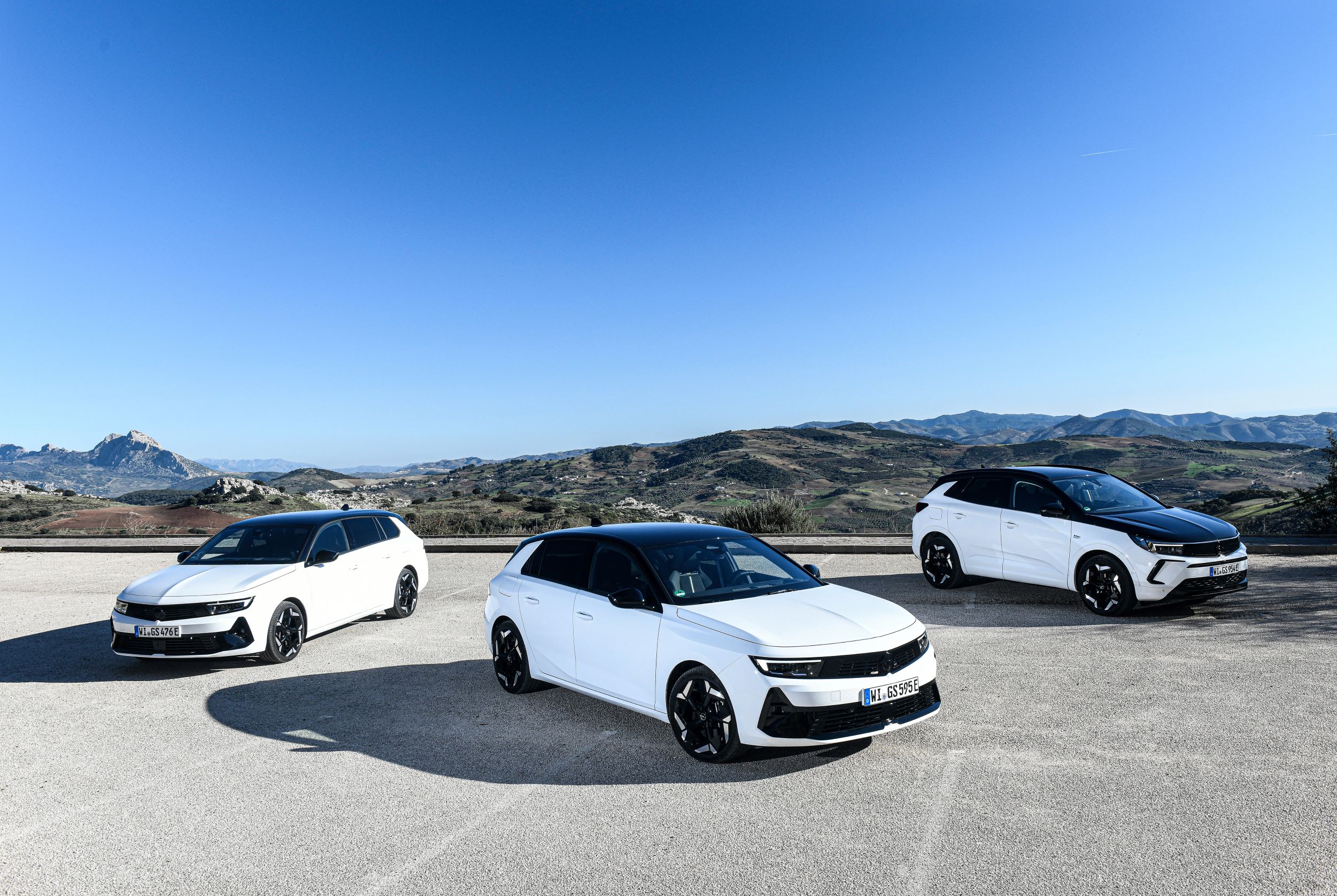 Three new Opel GSe models pictured in black and white paint schemes.