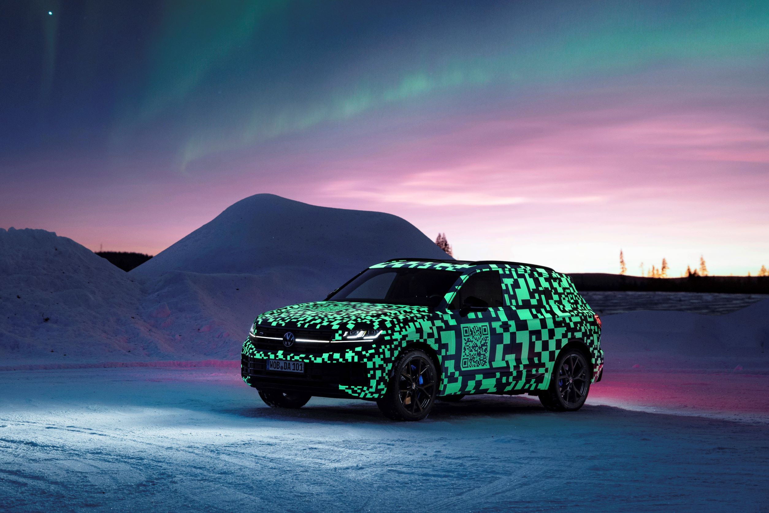 A new Volkswagen Touareg under testing, photographed under the Northern Lights