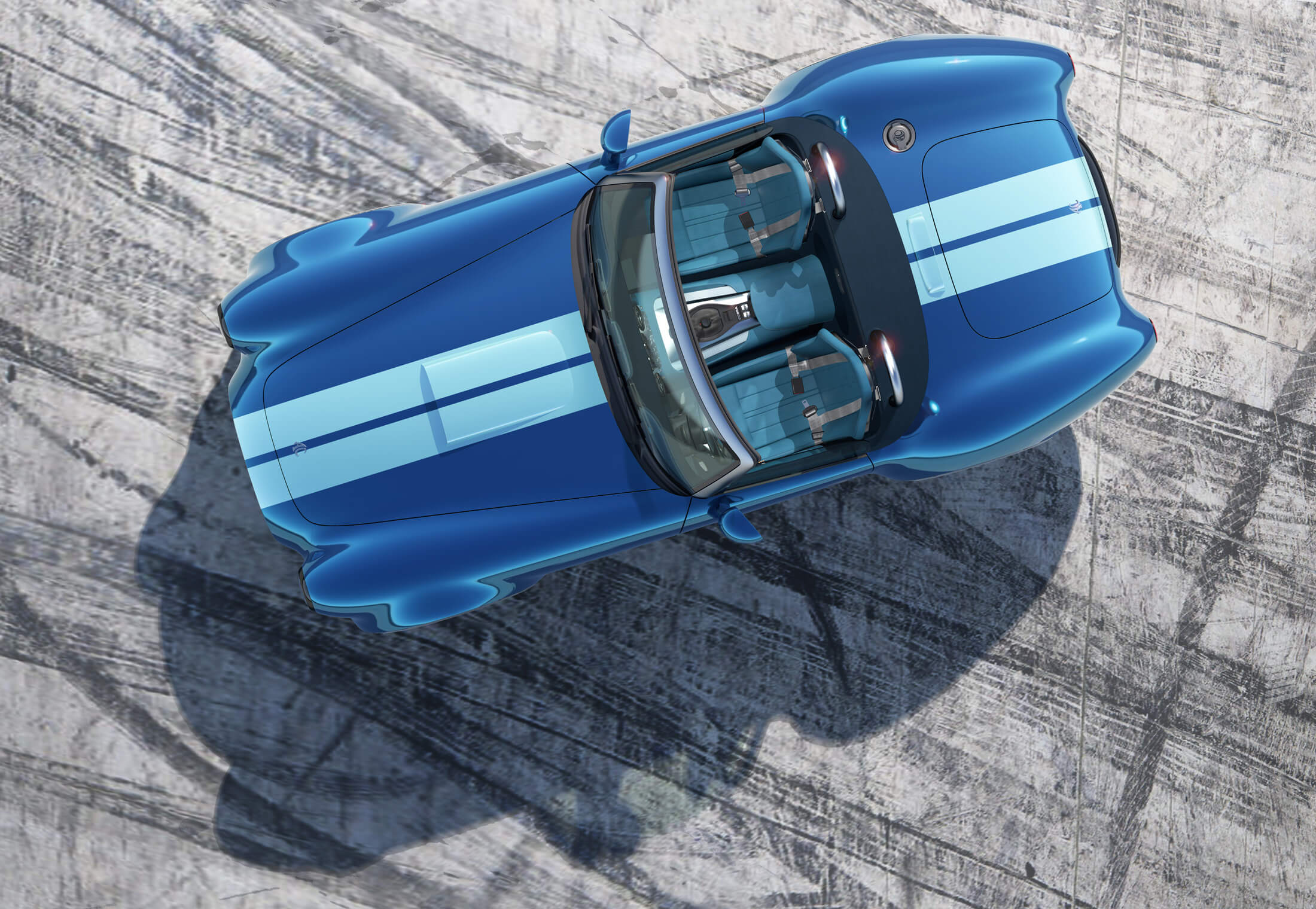 An overhead view of the upcoming AC Cobra GT roadster in blue with white stripes