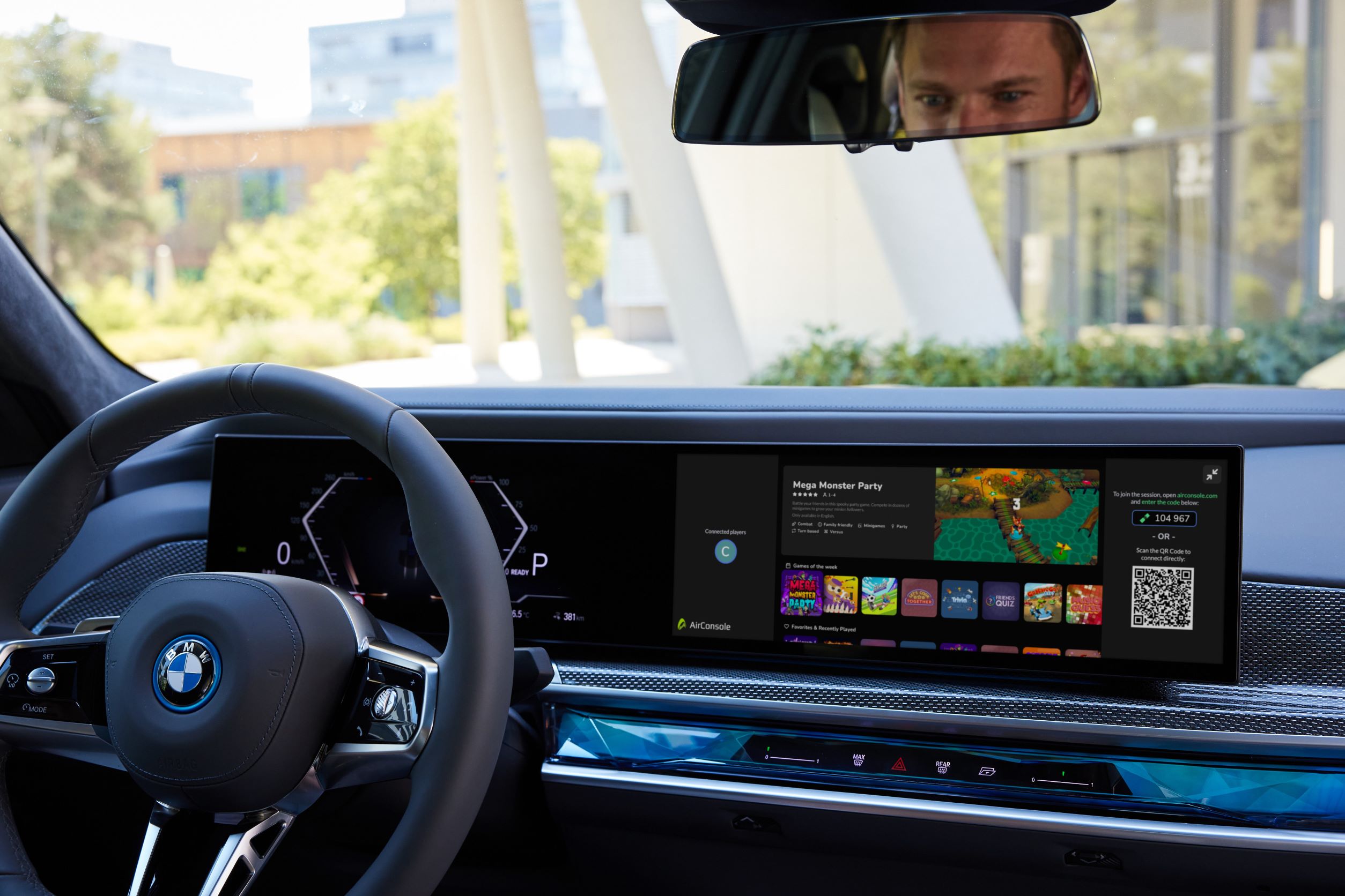 A photo of the interior of a BMW with a focus on the infotainment screen