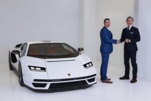 A white Lamborghini Countach pictured next to Stephen Winkelmann, CEO of Lamborghini and Alexandre Mea, CEO of Champagne Carbon
