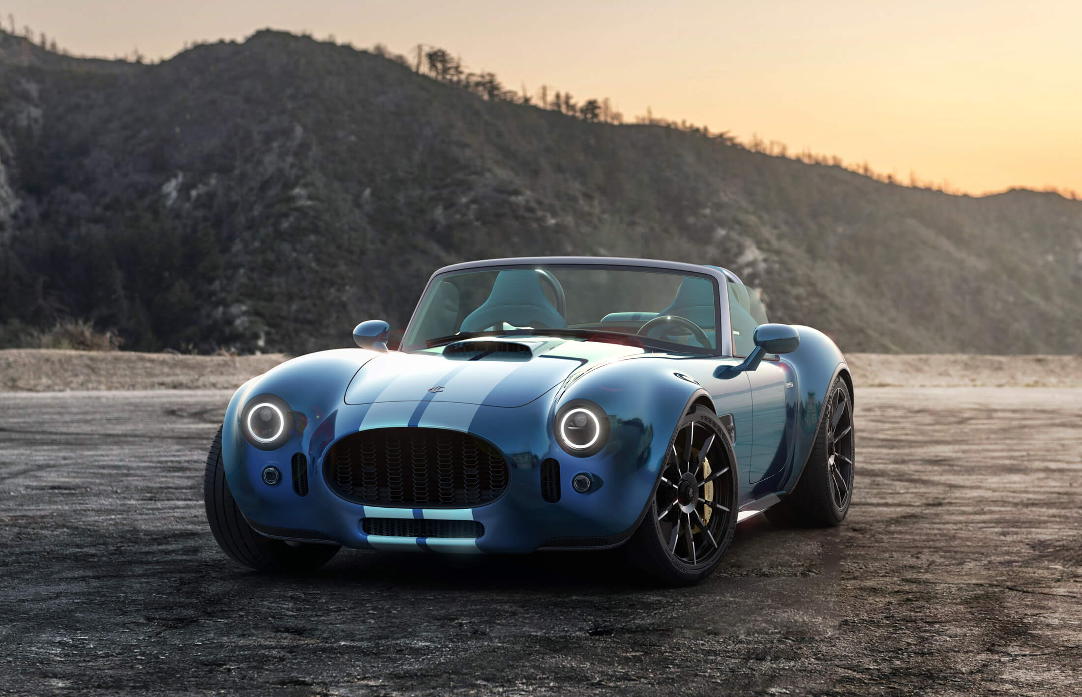 Front three quarters photo of the new AC Cobra in blue with white stripes