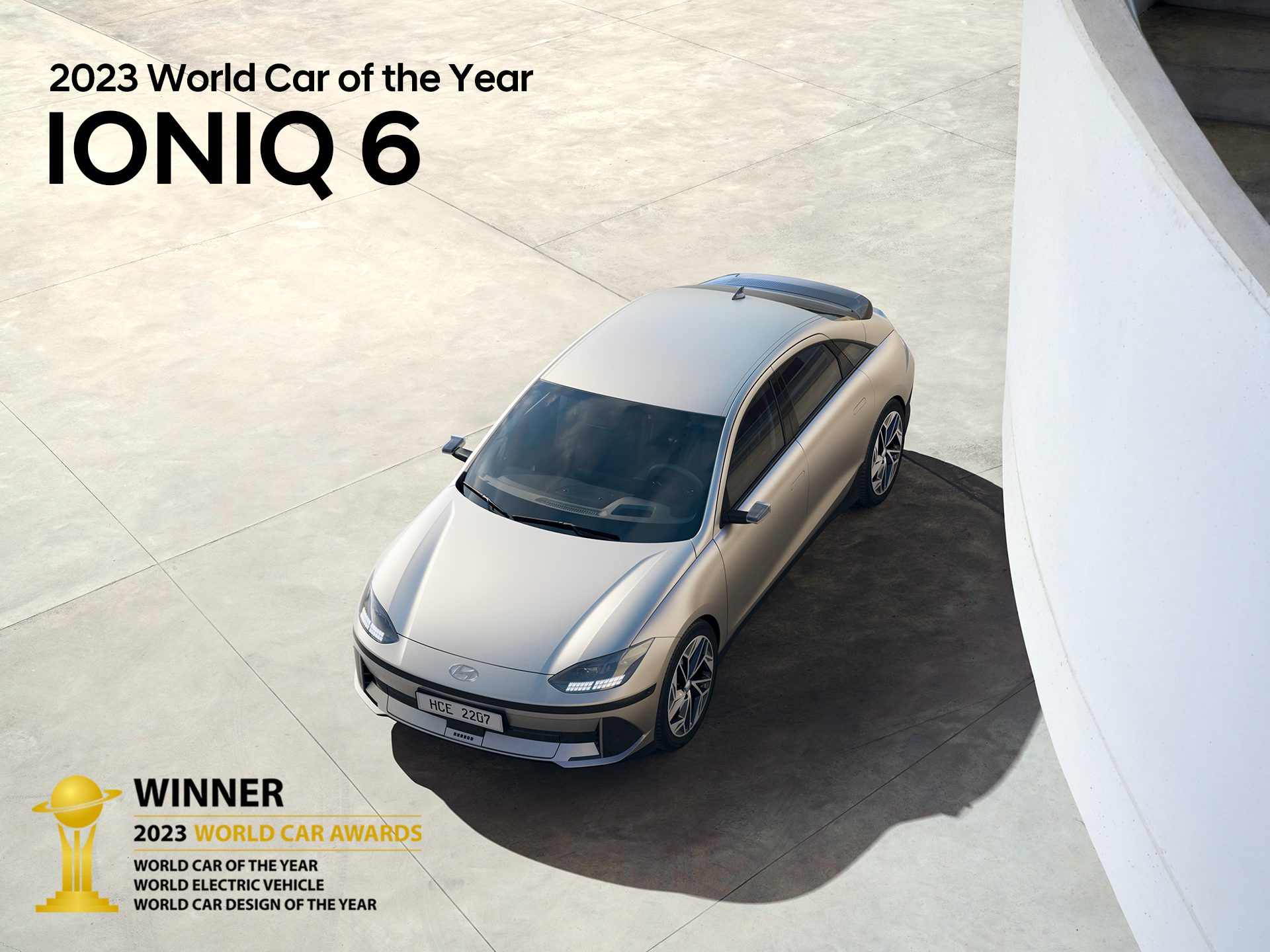 Overhead shot of the new Hyundai IONIQ 6 with a list of awards won at the 2023 Car of the Year Awards