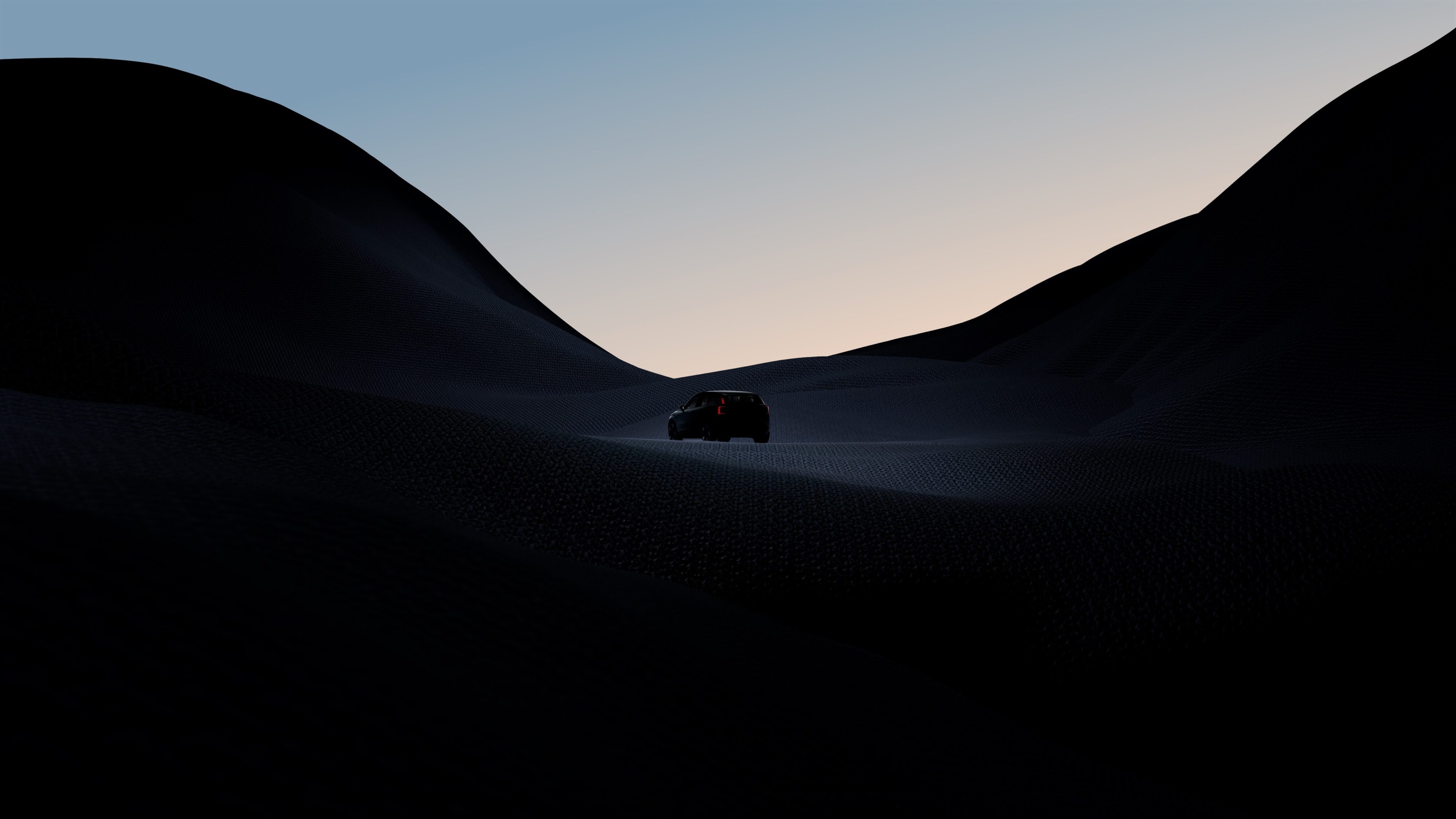 Teaser photo of the new Volvo EX30 SUV in a dark setting.