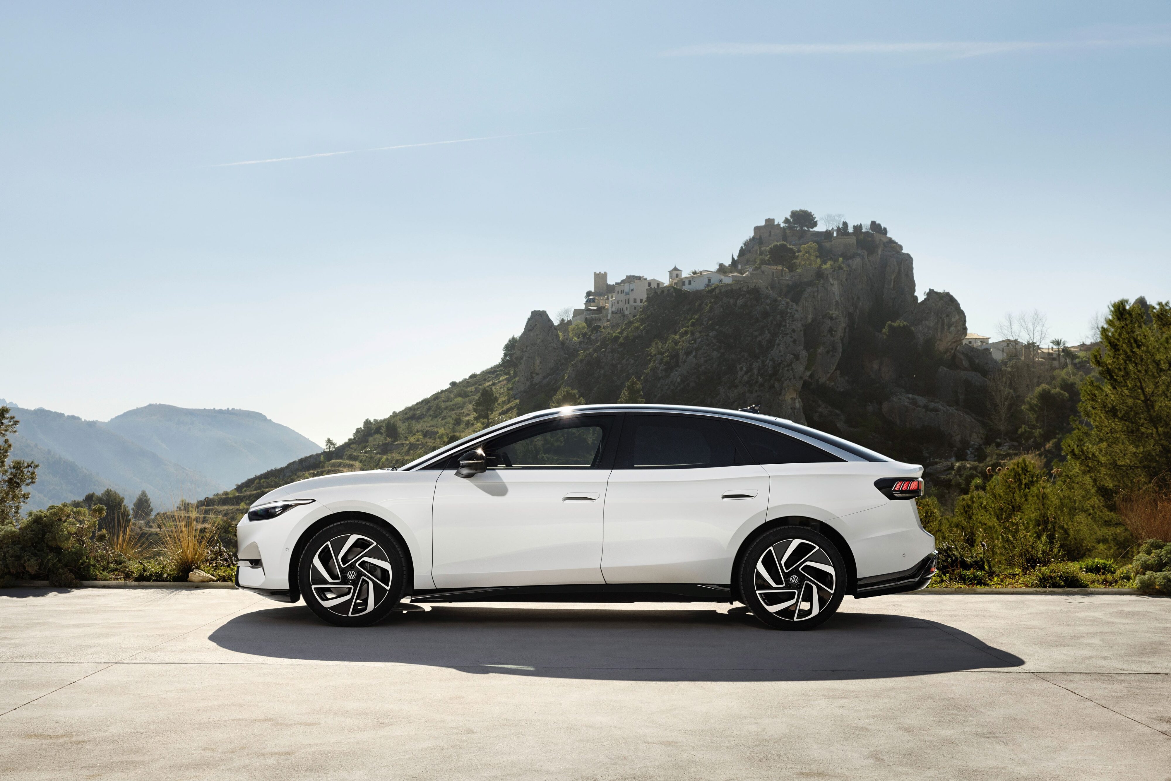 Side view of Volkswagen's new ID.7 electric limousine in a white and black colourway.