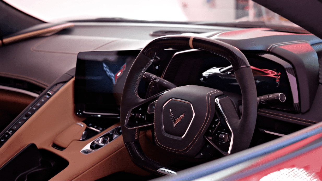 A peering through the window shot of the interior of the new 2023 Corvette Z06