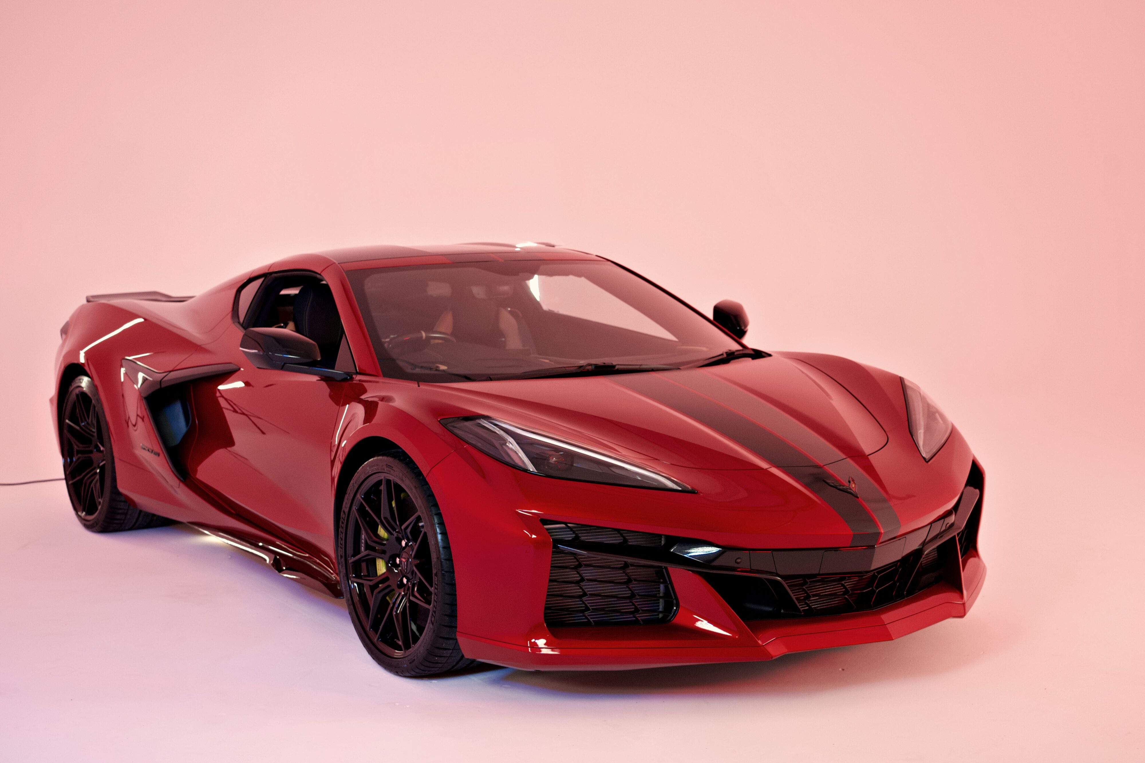 Front three quarters view of the new 2023 Corvette Z06 in metallic red.