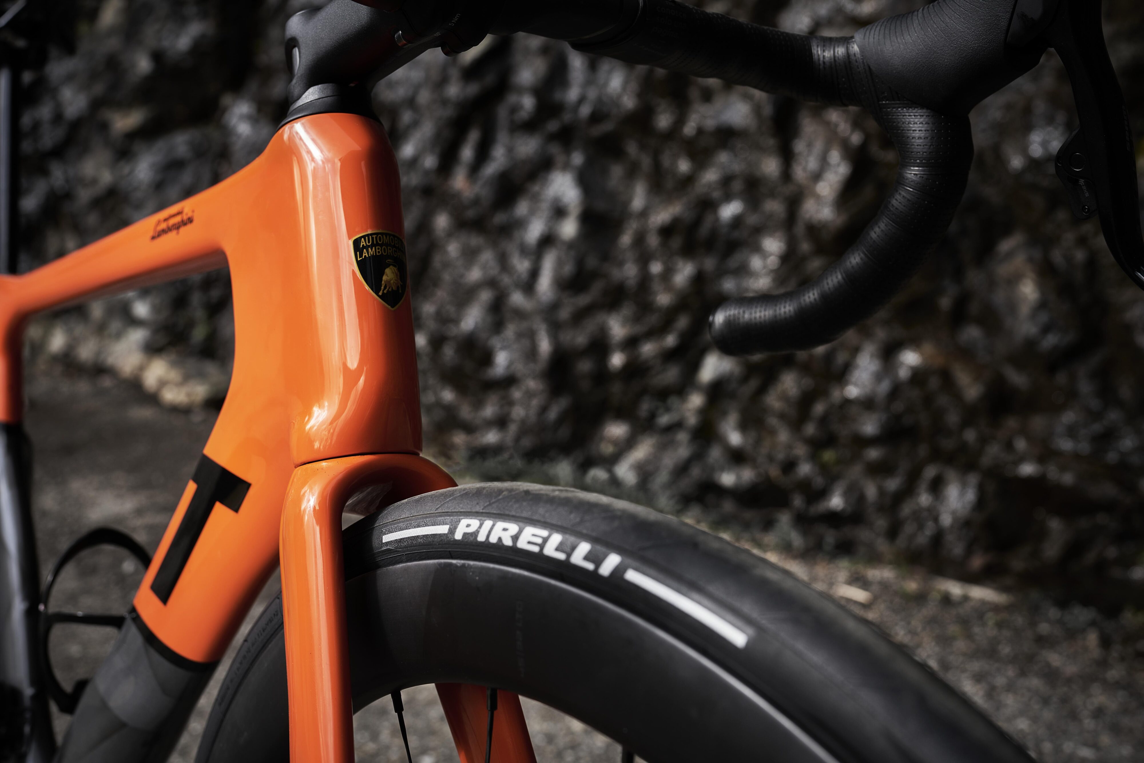 Close-up of the Lamborghini logo on the Automobili Lamborghini x 3T luxury bicycle in orange