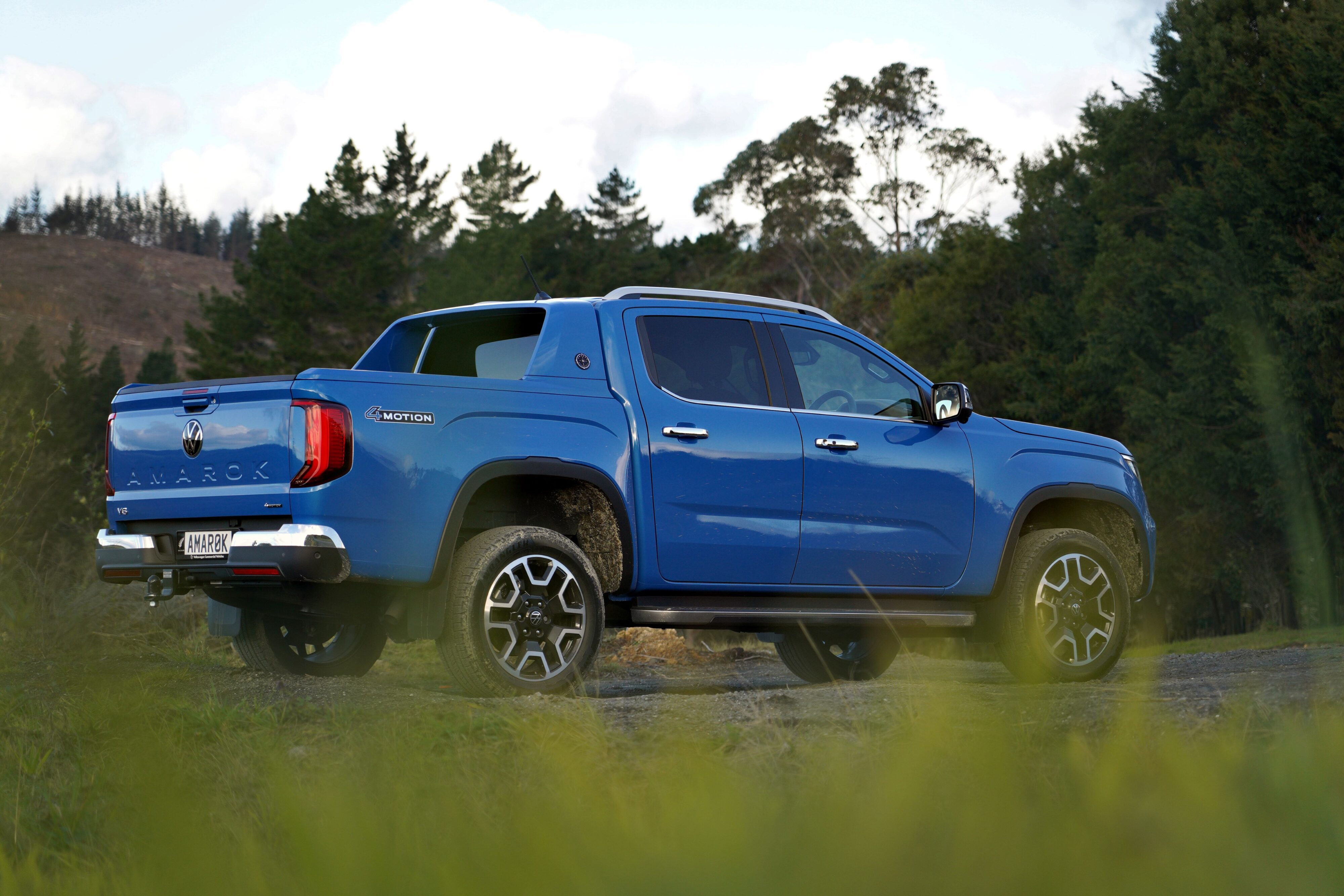 Side view of a blue 2023 Volkswagen Amarok Aventura