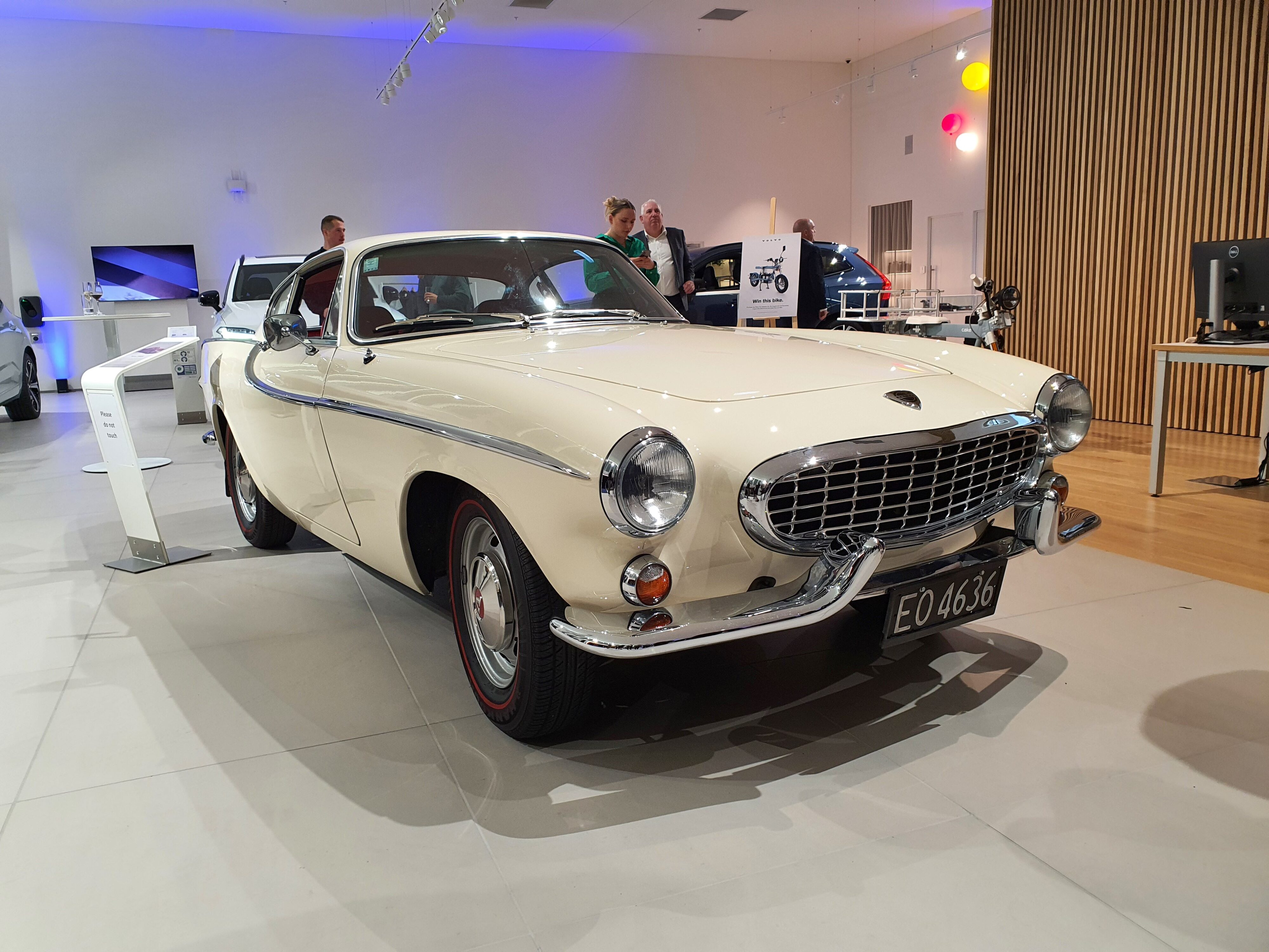 A white Volvo P1800S in focus at the opening of the new Volvo NZ flagship store in North Shore, Auckland at Archibald & Shorter.