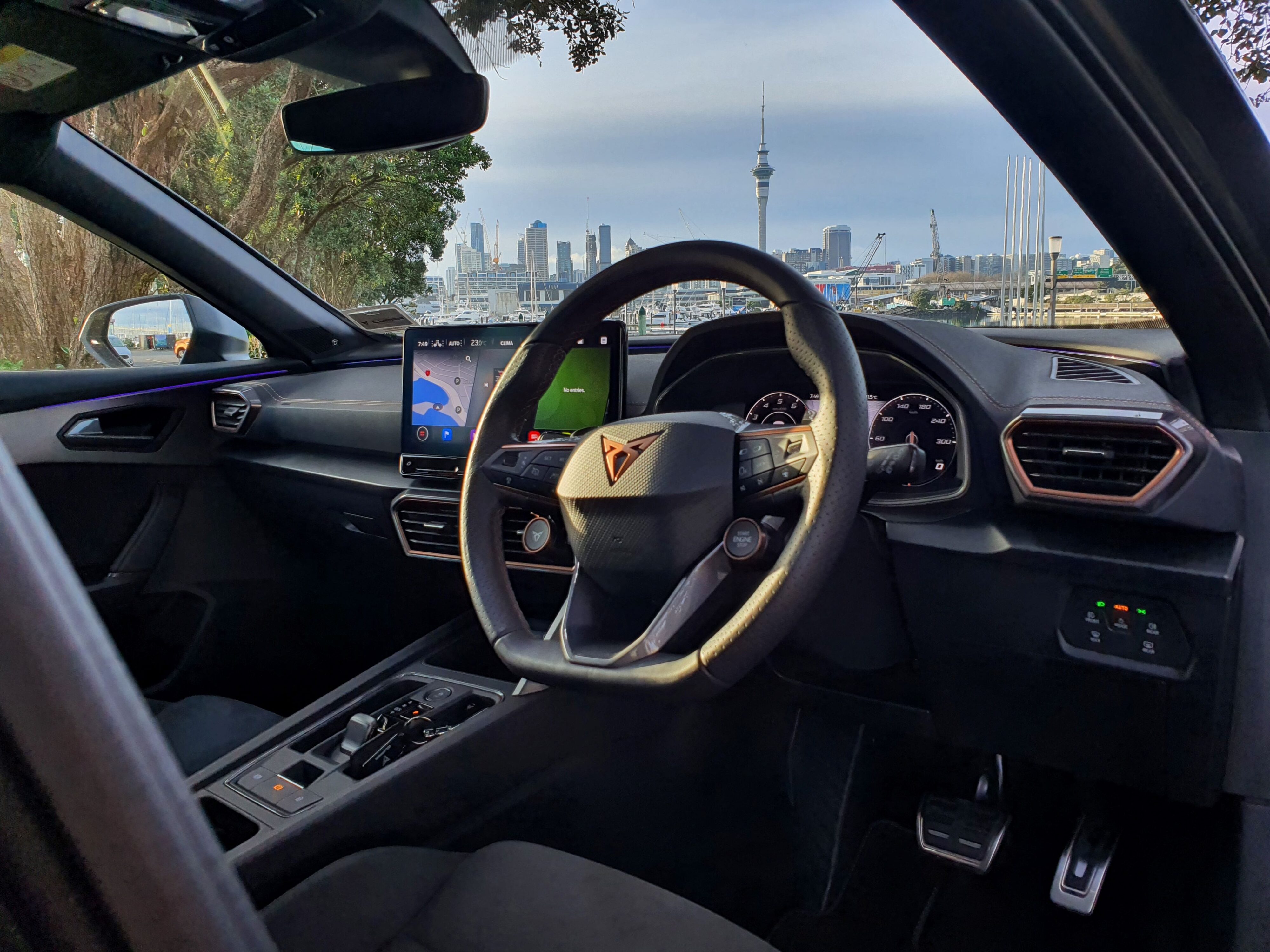 Interior photo of a Cupra Formentor VZ Tribe Edition with Auckland City in the background.
