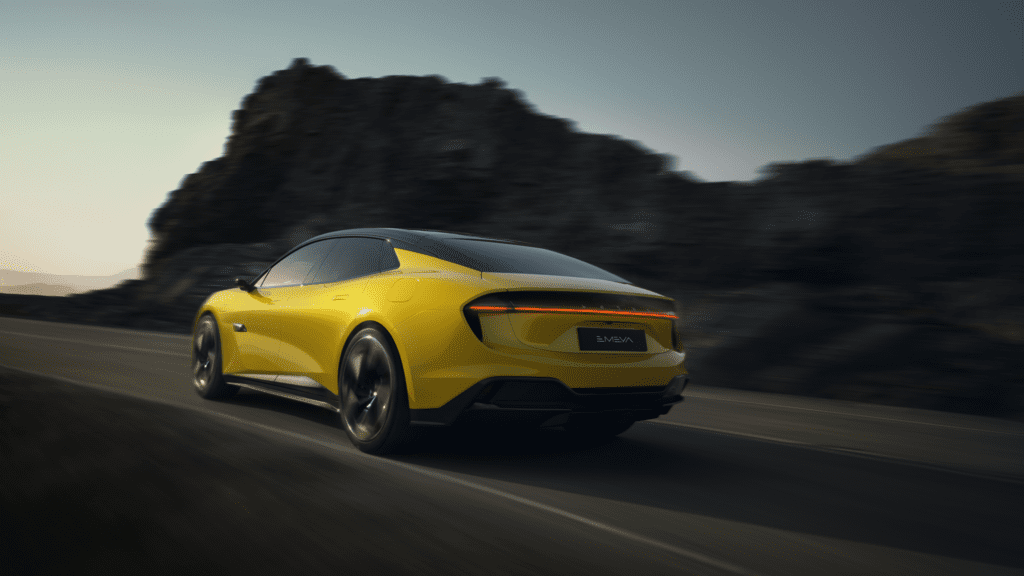 Rear motion shot of a Lotus Emeya EV in yellow.